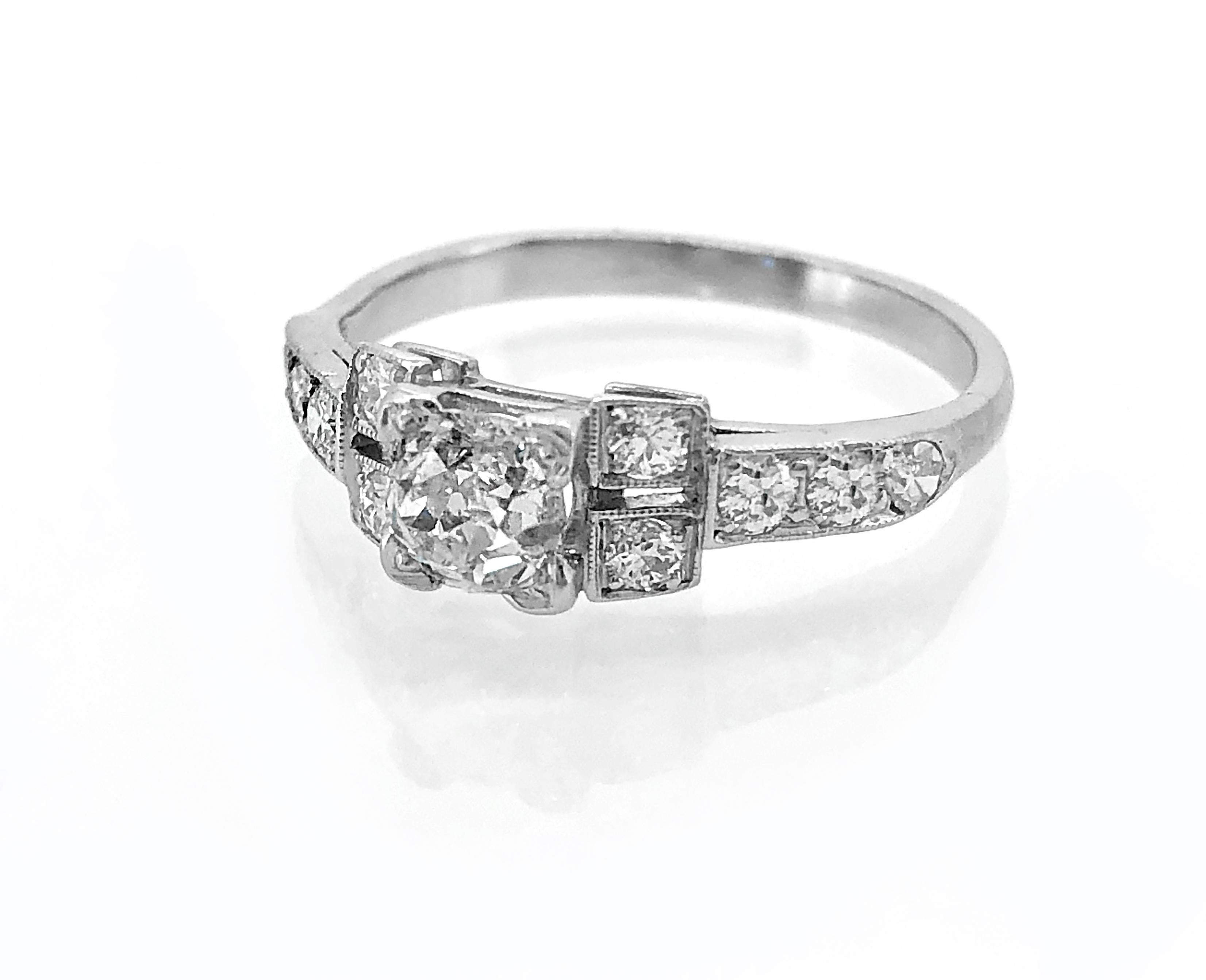 An original feminine vintage engagement ring featuring a .58ct. antique cushion cut diamond with I1 clarity and I color. Complimenting the center stone are .15ct. apx. T.W. of single cut diamond melee that are beautifully set in a split shank. Very