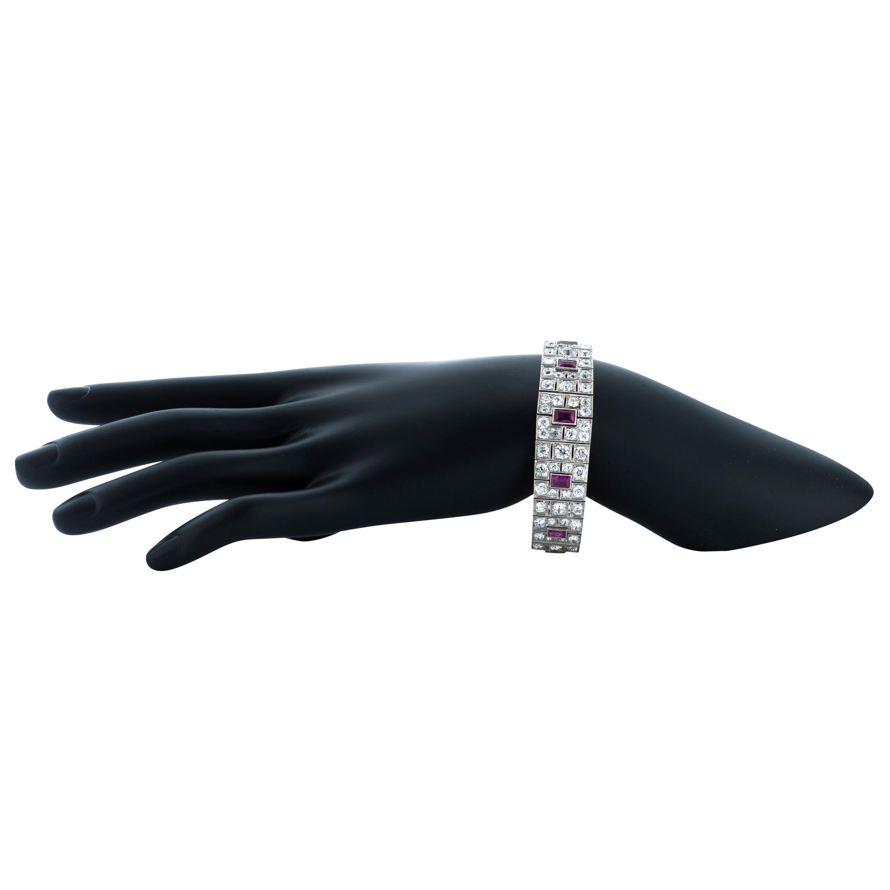 Art Deco platinum ruby and diamond bracelet with French Hallmarks.  

This bracelet contains 8 baguette shaped rubies totaling approximately 5.00 carats,  as well as 140 old European cut diamonds totaling approximately 20.00 carats with H-I-J color