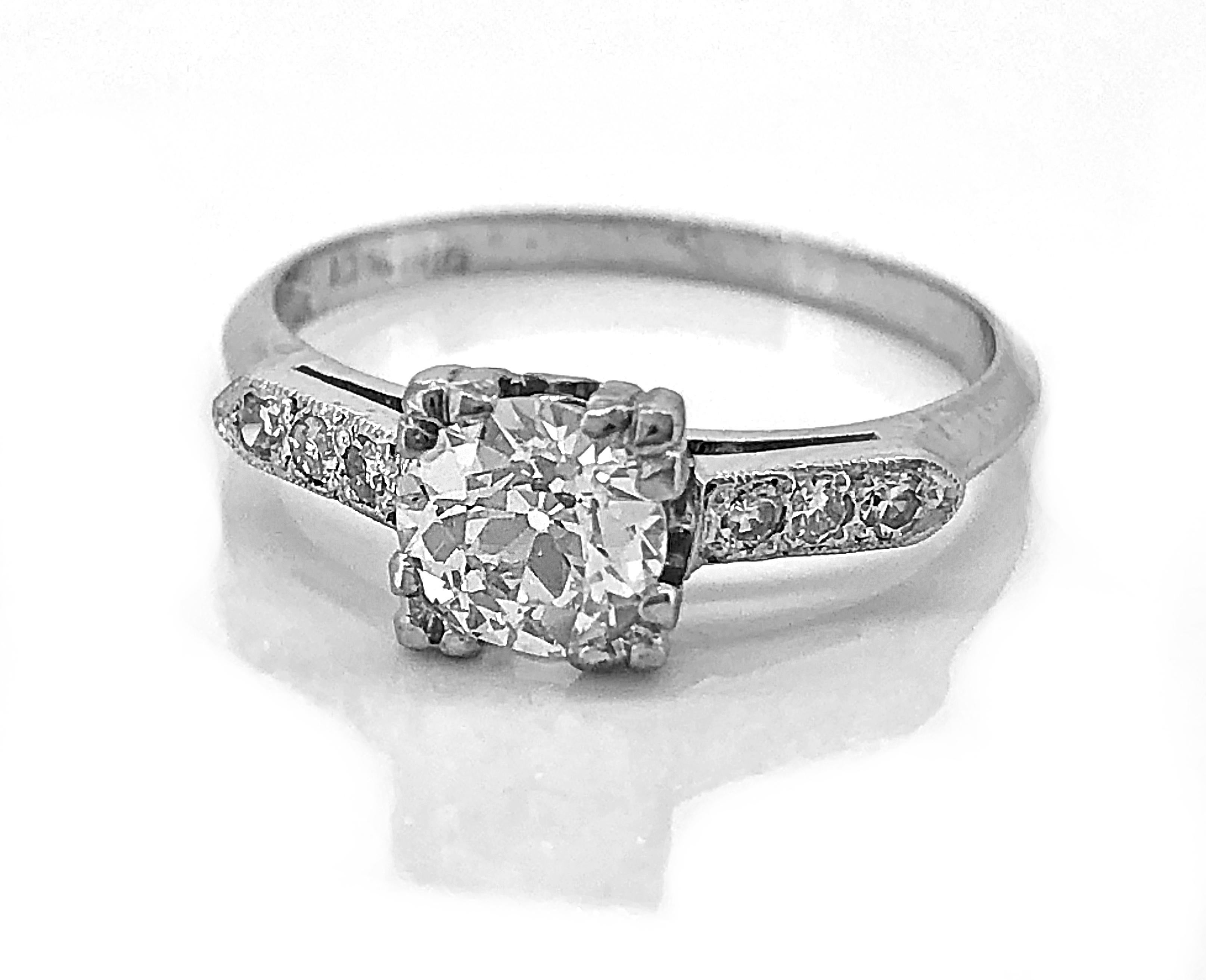 An outstanding Art Deco antique engagement ring crafted in platinum that features a .62ct. apx. European cut center diamond with VVS2-VS1 clarity and G color. This is a very high quality diamond with a classic and traditional design. Bright and