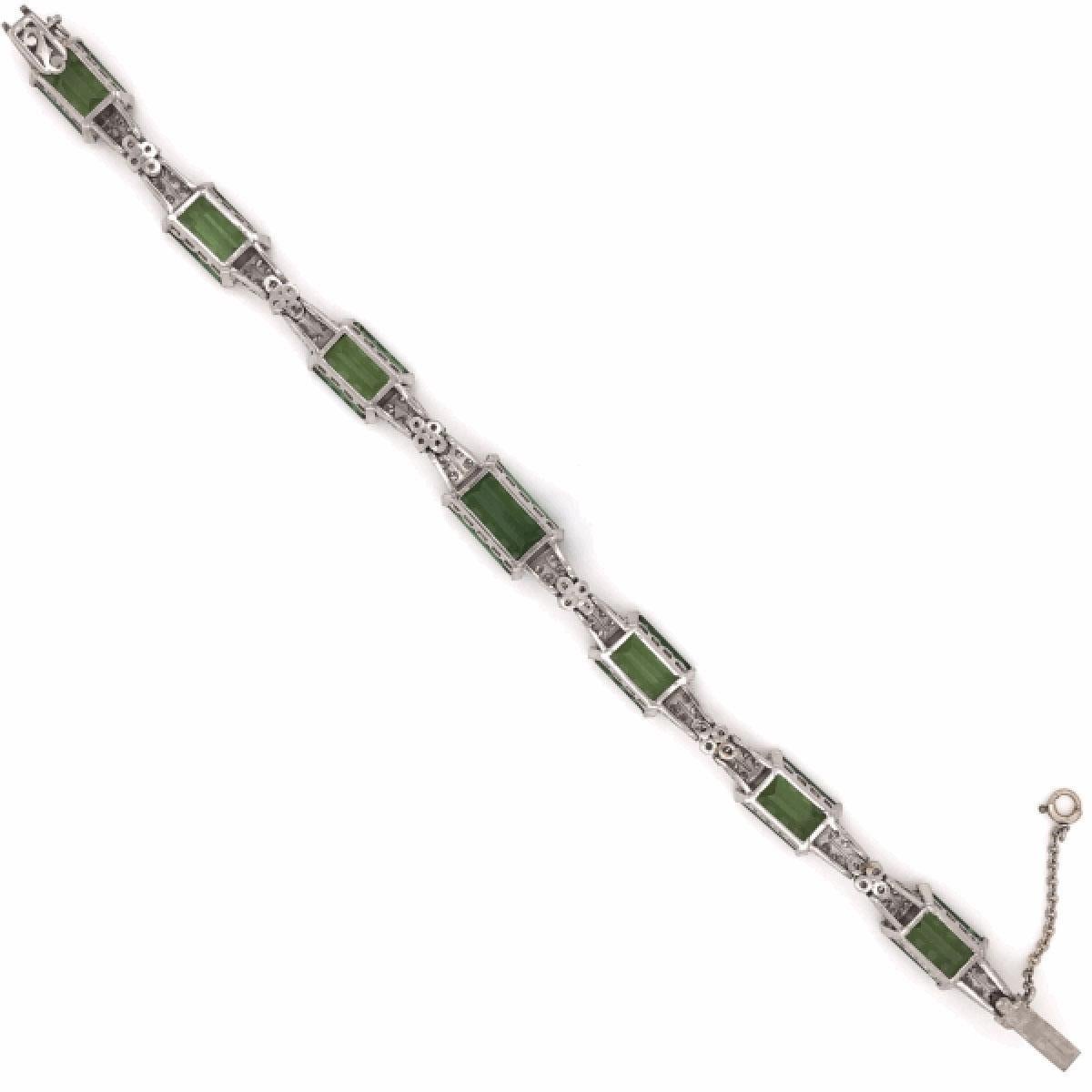 Simply Beautiful & finely detailed Art Deco Green Tourmaline and Diamond Platinum Bracelet set with securely nestled Tourmaline,  approx. 62 Carat total weight and Diamonds, approx. 2.40 Carat total weight; Bracelet  measures approx. 7 inches long.