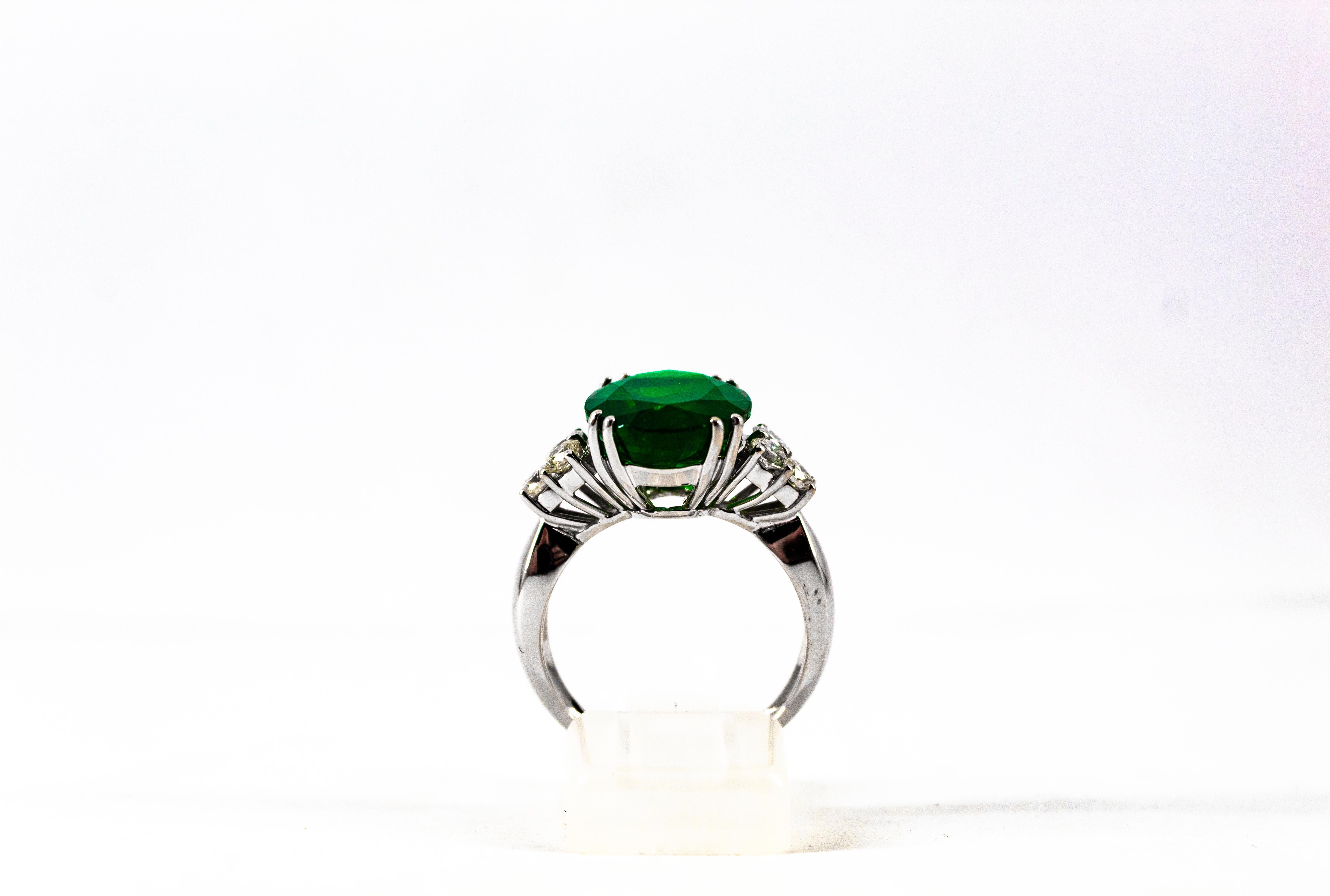 This Ring is made of 18K White Gold.
This Ring has 0.60 Carats of White Modern Round Cut Diamonds. Color: H-G Clarity: VVS1
This Ring has a 6.42 Carats Natural Zambia Oval Cut Emerald.

Size ITA: 15 USA: 7

We're a workshop so every piece is