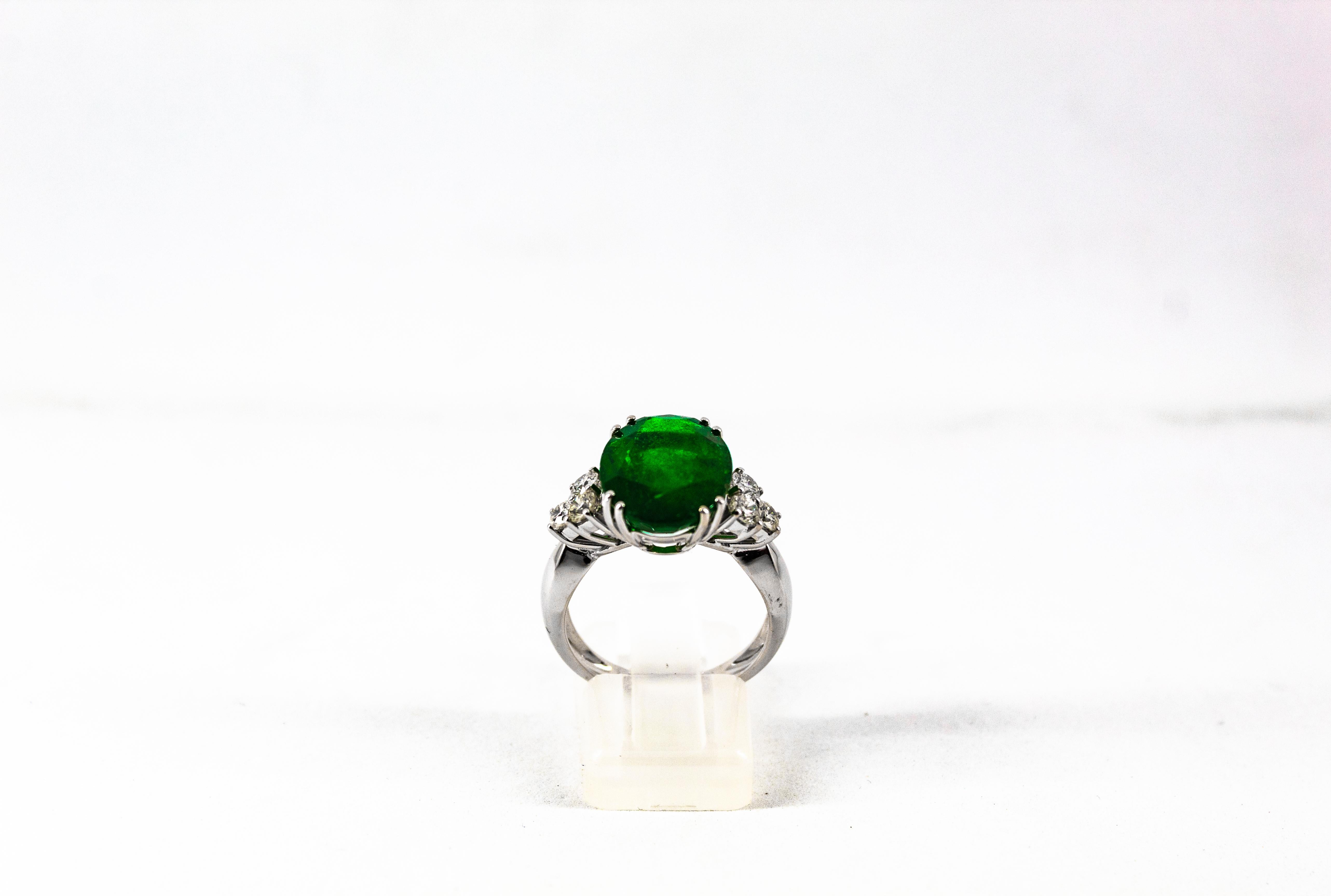 Oval Cut Art Deco 6.42 Carat Emerald 0.60 Carat White Diamond White Gold Cocktail Ring For Sale
