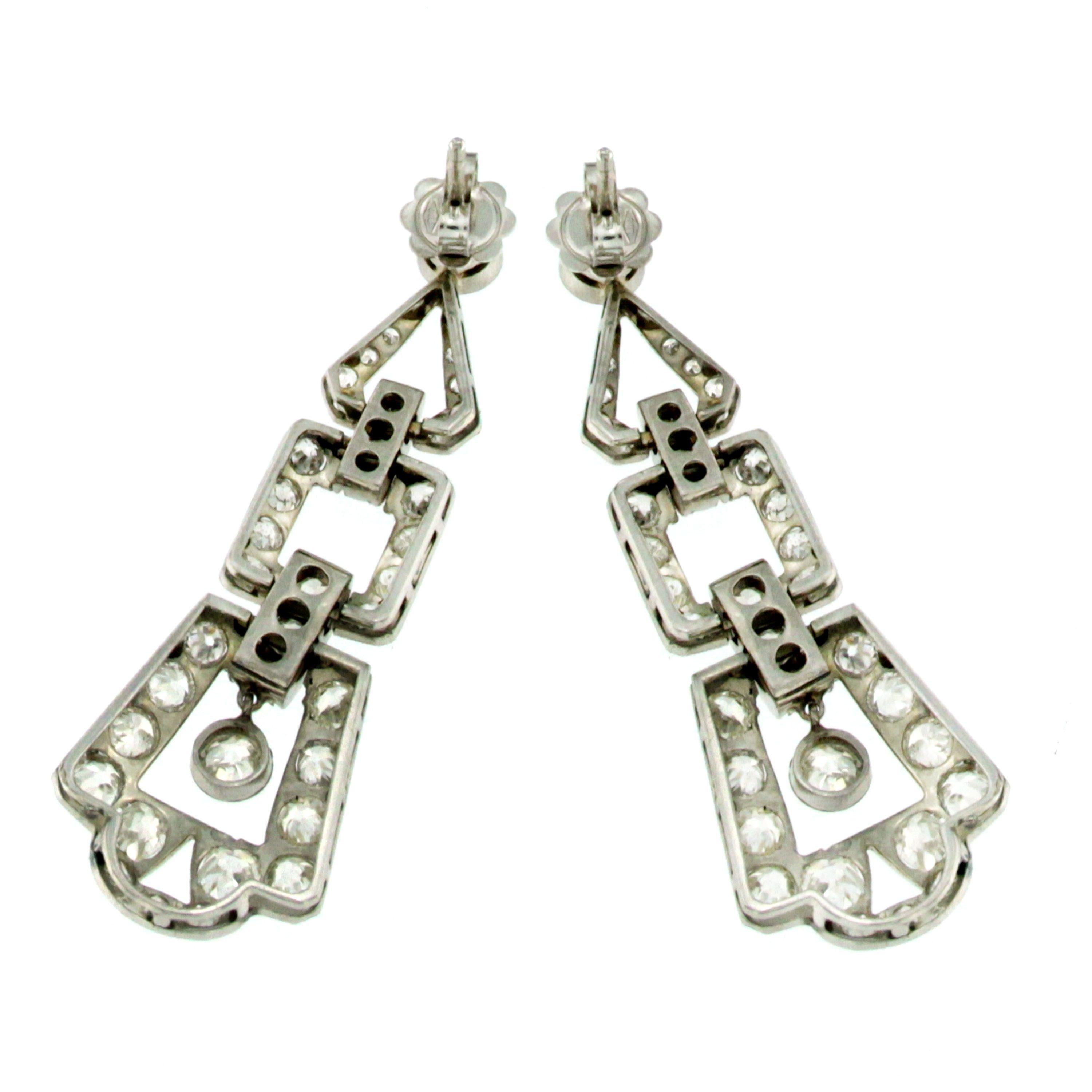 Stunning genuine Art Deco earrings, set with Sparkling Old Mine Cut Diamonds, weighing total 6.50 carats and graded H/I/J color Vs clarity

Authentic from 1930' , origin Europe, these earrings are distinguished by the classic design of that