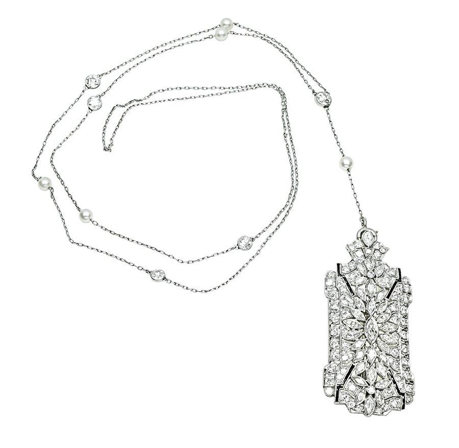 This is a stunning platinum pin / pendant necklace from the Art Deco era. The pin / pendant is set with sparkling marquise and old mine cut diamonds that weigh approximately 4.00ct. The chain is set with dazzling old mine cut diamonds that weigh
