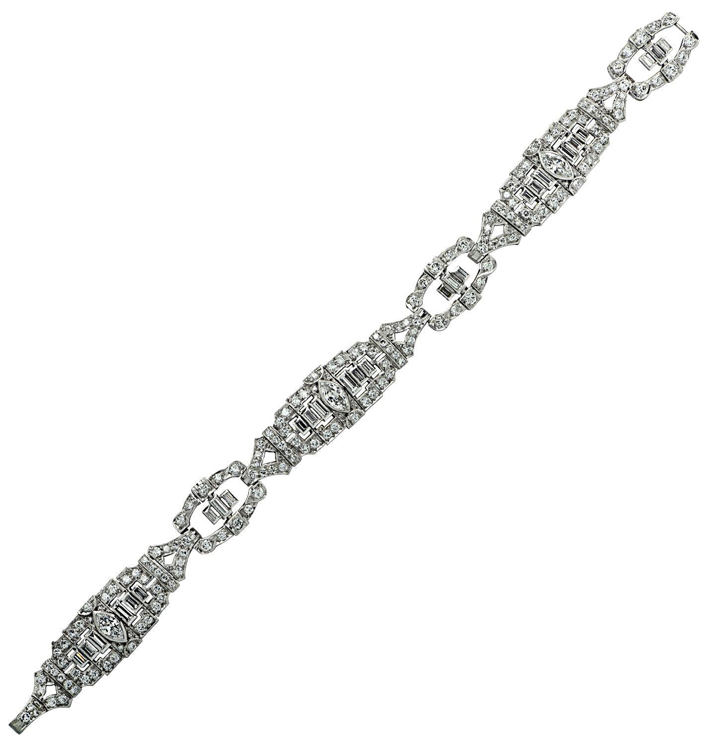 Beautiful Art Deco bracelet finely crafted in platinum featuring 3 marquise cut diamonds weighing approximately 1 carat total, 27 baguette cut diamonds weighing approximately 1.80 carats total and 172 mixed round brilliant cut and single cut