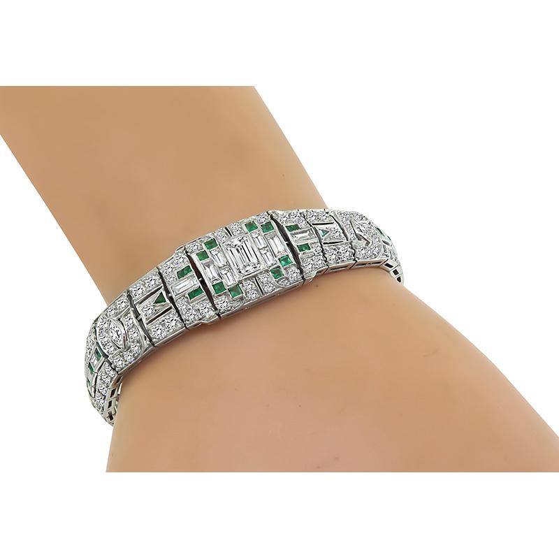 This is an amazing platinum bracelet from the Art Deco era. The bracelet is set with sparkling emerald, baguette, round and marquise cut diamonds that weigh approximately 6.80ct. The color of these diamonds is F-G with VS clarity. The diamonds are