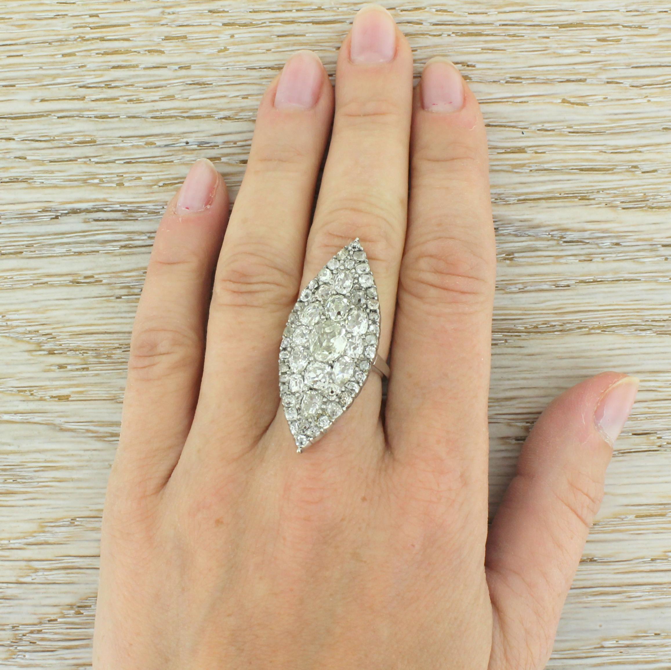 Women's Art Deco 6.85 Carat Old Cut Diamond Platinum Navette Cluster Ring