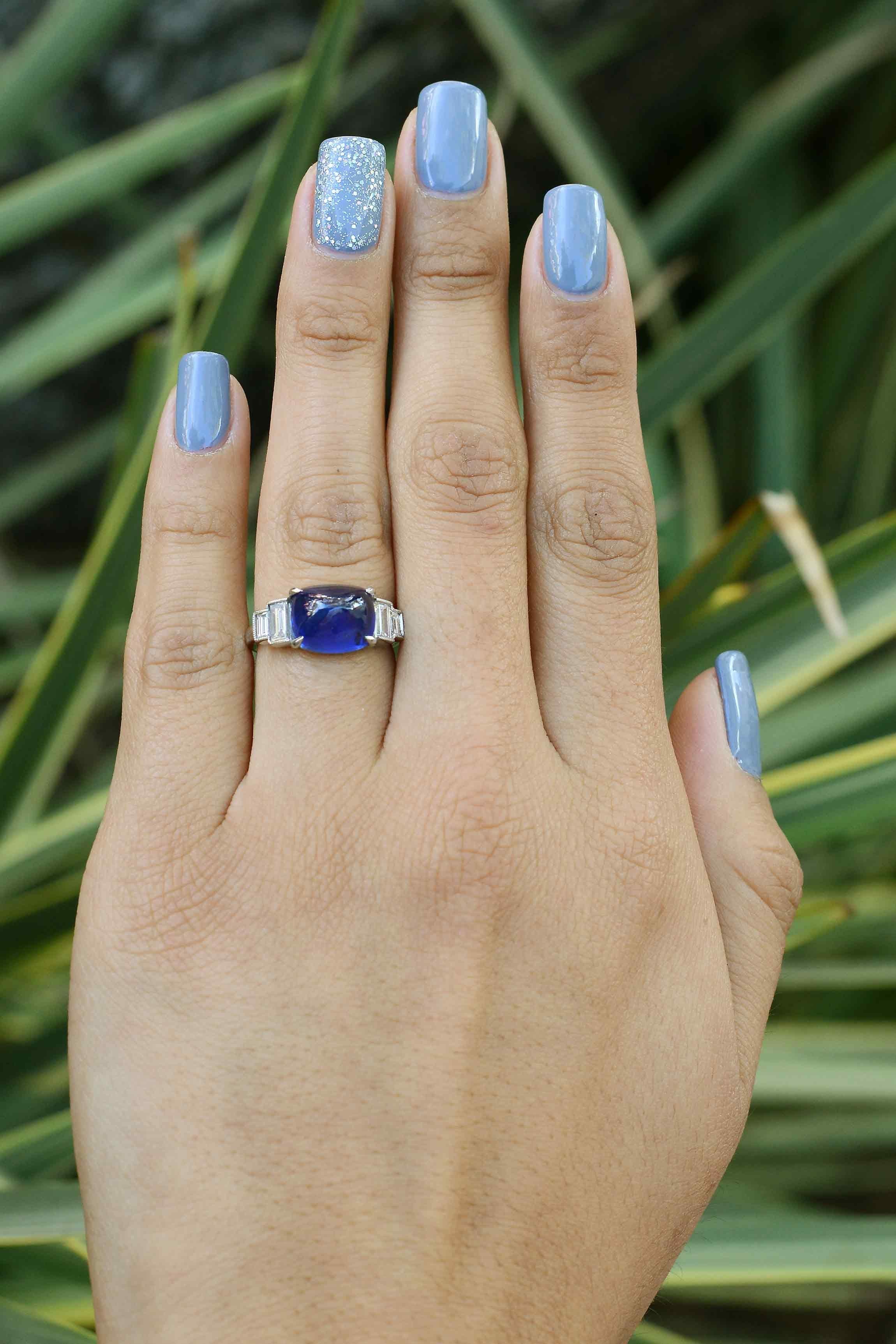 The Ojai is an authentic Art Deco sugarloaf sapphire and diamond engagement ring. Standing tall in the saddle is a 7 carat cabochon of an intensely vivid royal blue, possessing a fabulous luster and Kashmir type color. Fashioned as a dome pyramid,