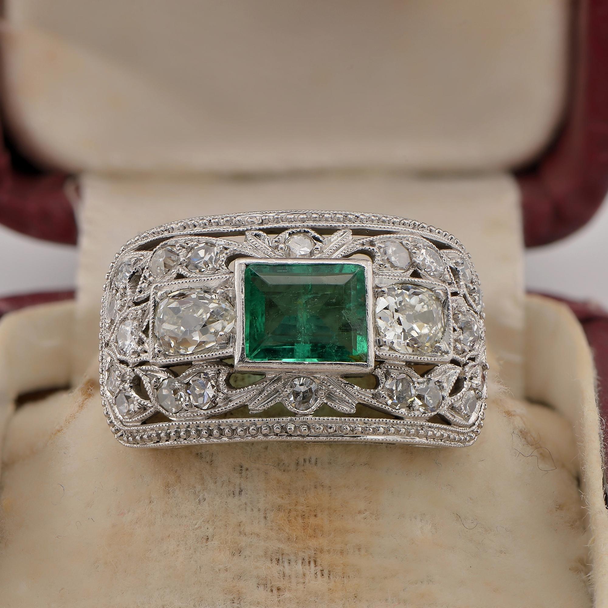 Art Deco Elegance
This original and quite unique Art Deco ring is dated 1920 ca
Hand crafted of solid Platinum in a tasteful horizontal panel with beautiful openwork scroll design mill-point detailed throughout, highlighted by old cut Diamonds with