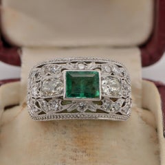 Art Deco .70 Ct Colombian Emerald . 75 Ct. Diamond Platinum ring