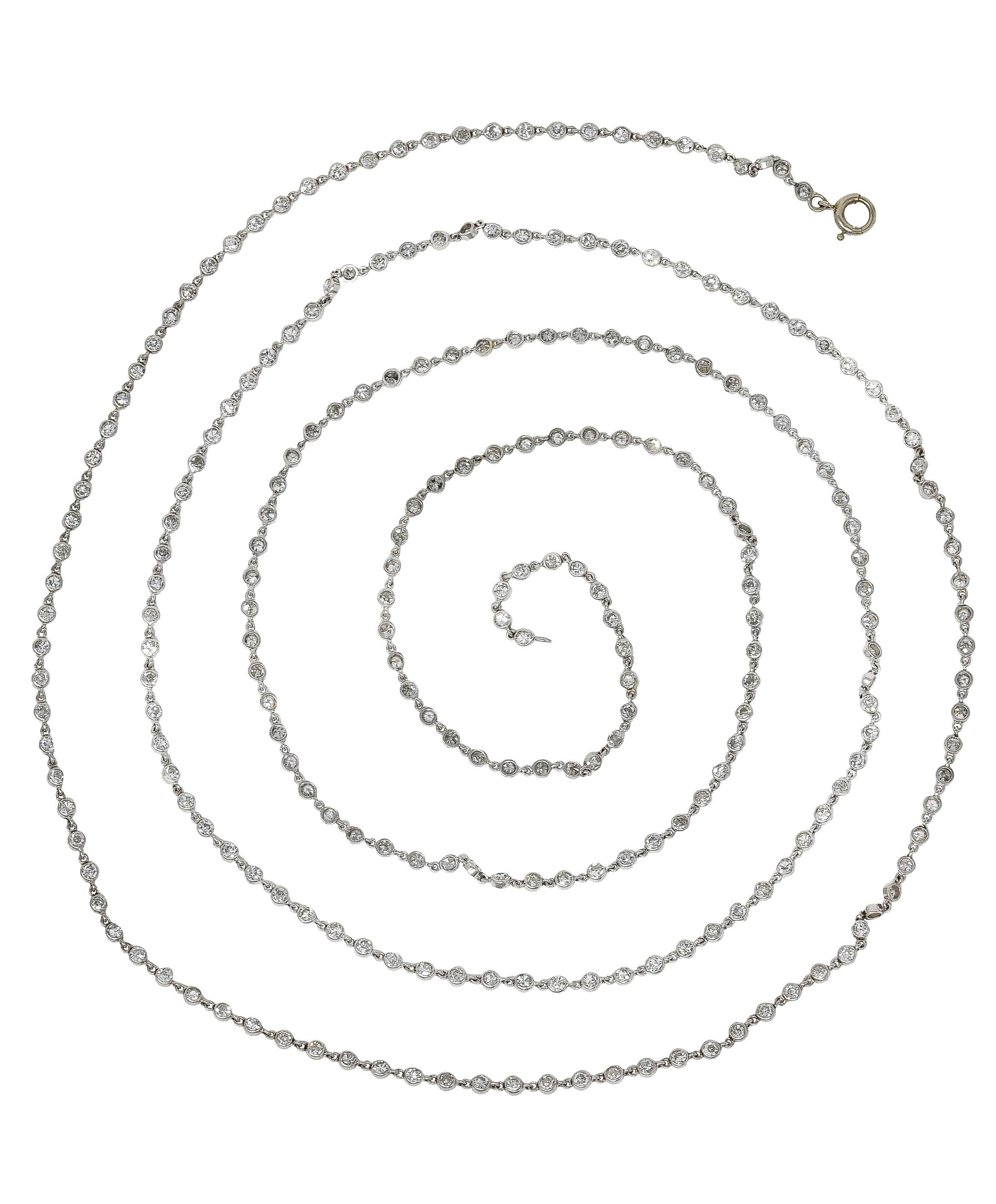 Long chain necklace is comprised of bezel set diamond links. Articulated and featuring single cut diamonds. Weighing in total approximately 7.50 carats - G to I color with SI clarity. Completed by a white gold spring ring clasp - tested. Links