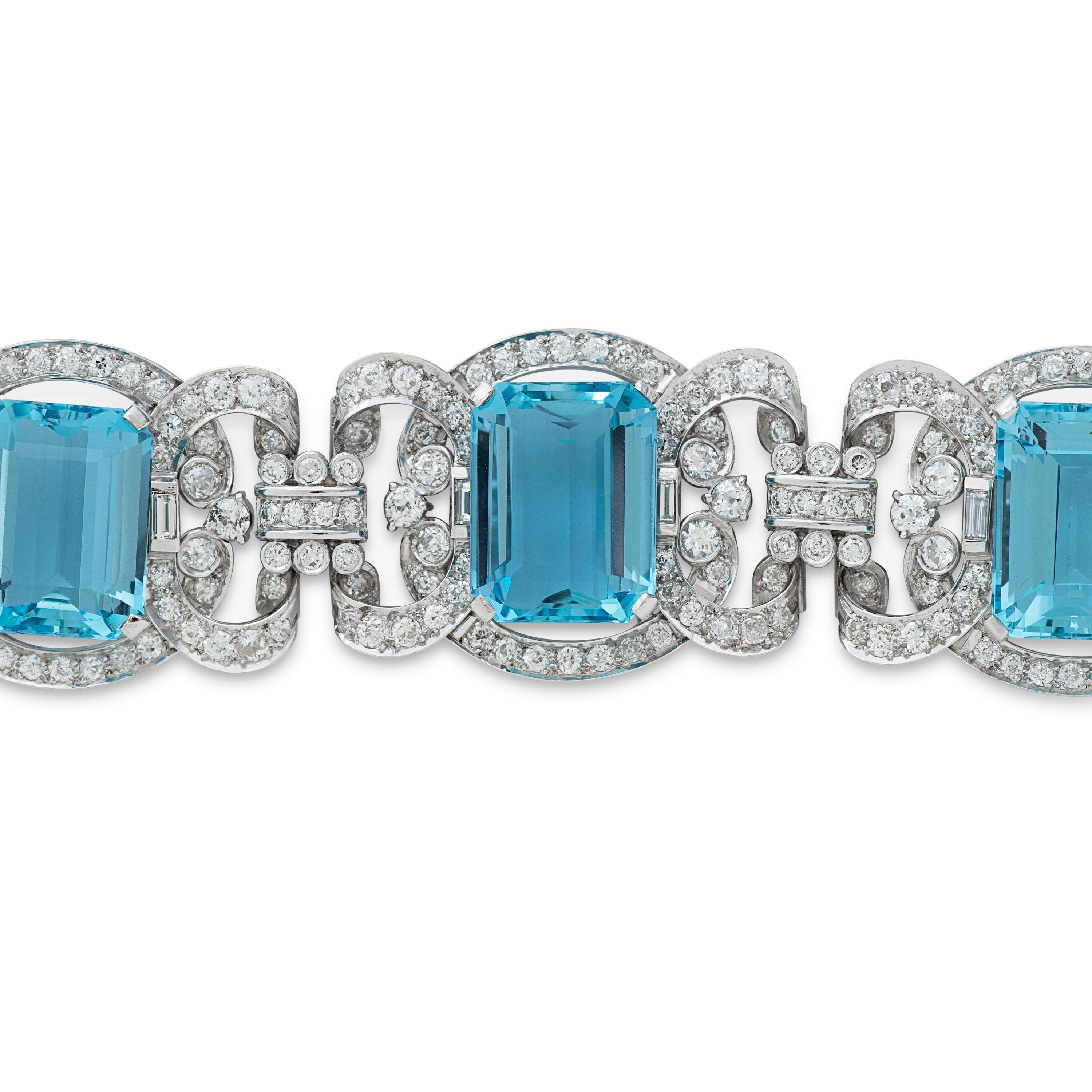 Art Deco aquamarine and diamond link bracelet with platinum setting.  5 emerald cut aquamarines 
totaling approximately 75.91ct are set amidst approximately 10.00ct of diamonds estimated to be 
G-H color with VS clarity.  
This bracelet measures