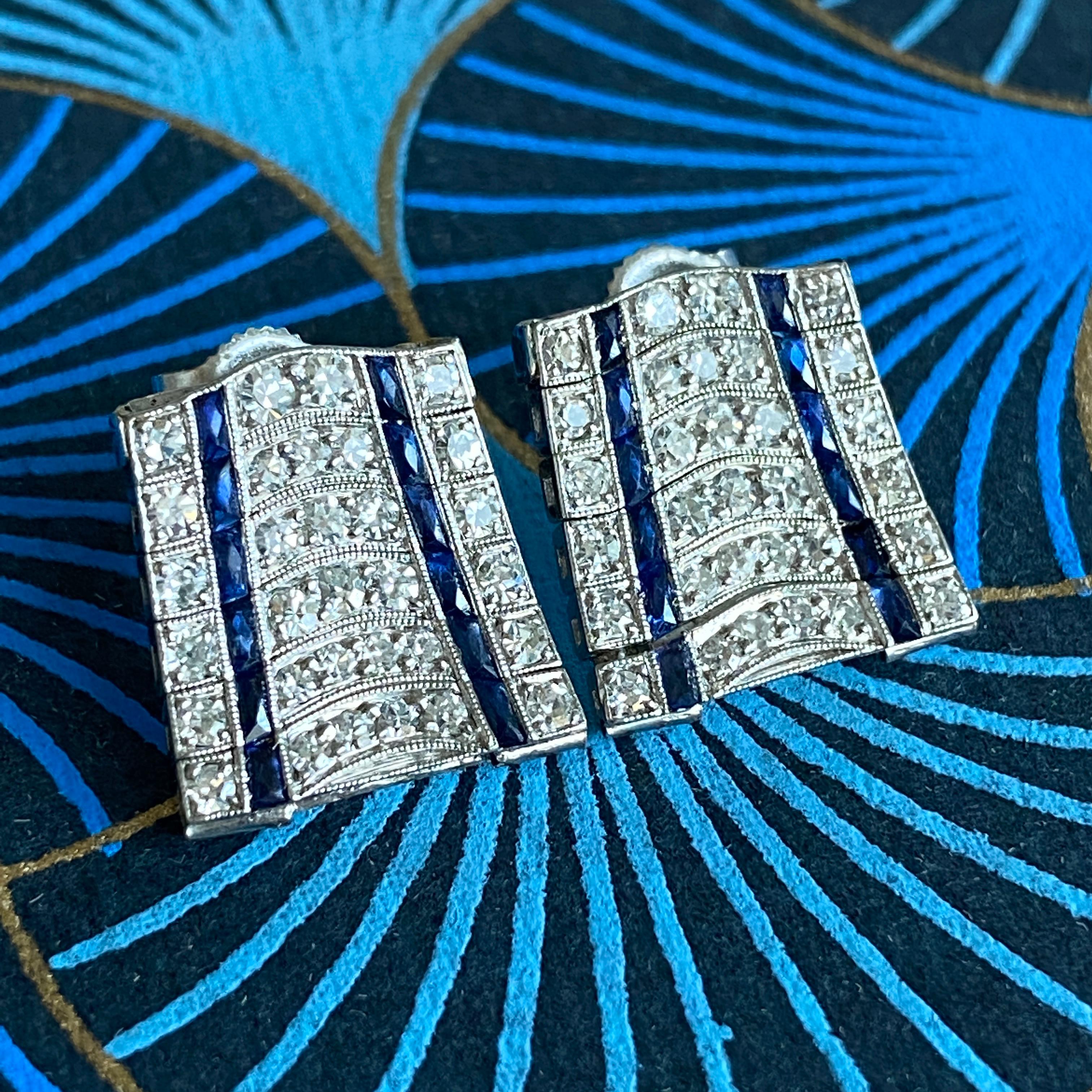 Details:
Fabulous Art Deco Diamond and Sapphire earrings in Platinum. These stunning earrings have 3/4 carat of diamonds and 1/4 carats of sapphires. The earrings are made up of little hinged strips of platinum, they articulate and catch the light