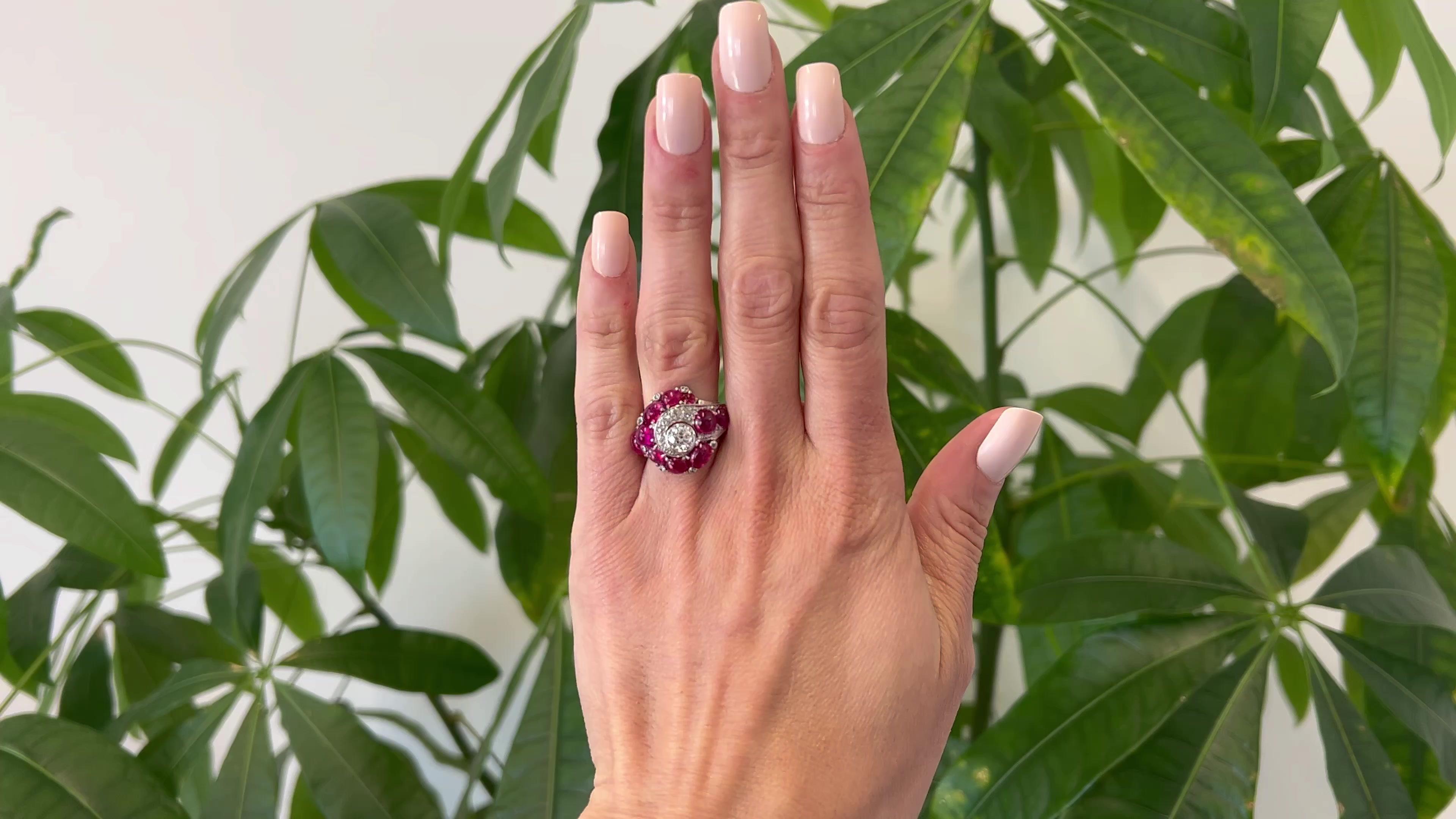 One Art Deco 7.75 Carat Total Weight Ruby and Diamond Platinum Ring. Featuring one old European cut diamond weighing approximately 0.75 carat, graded I color, VS1 clarity. Accented by 19 single and old European cut diamonds with a total weight of