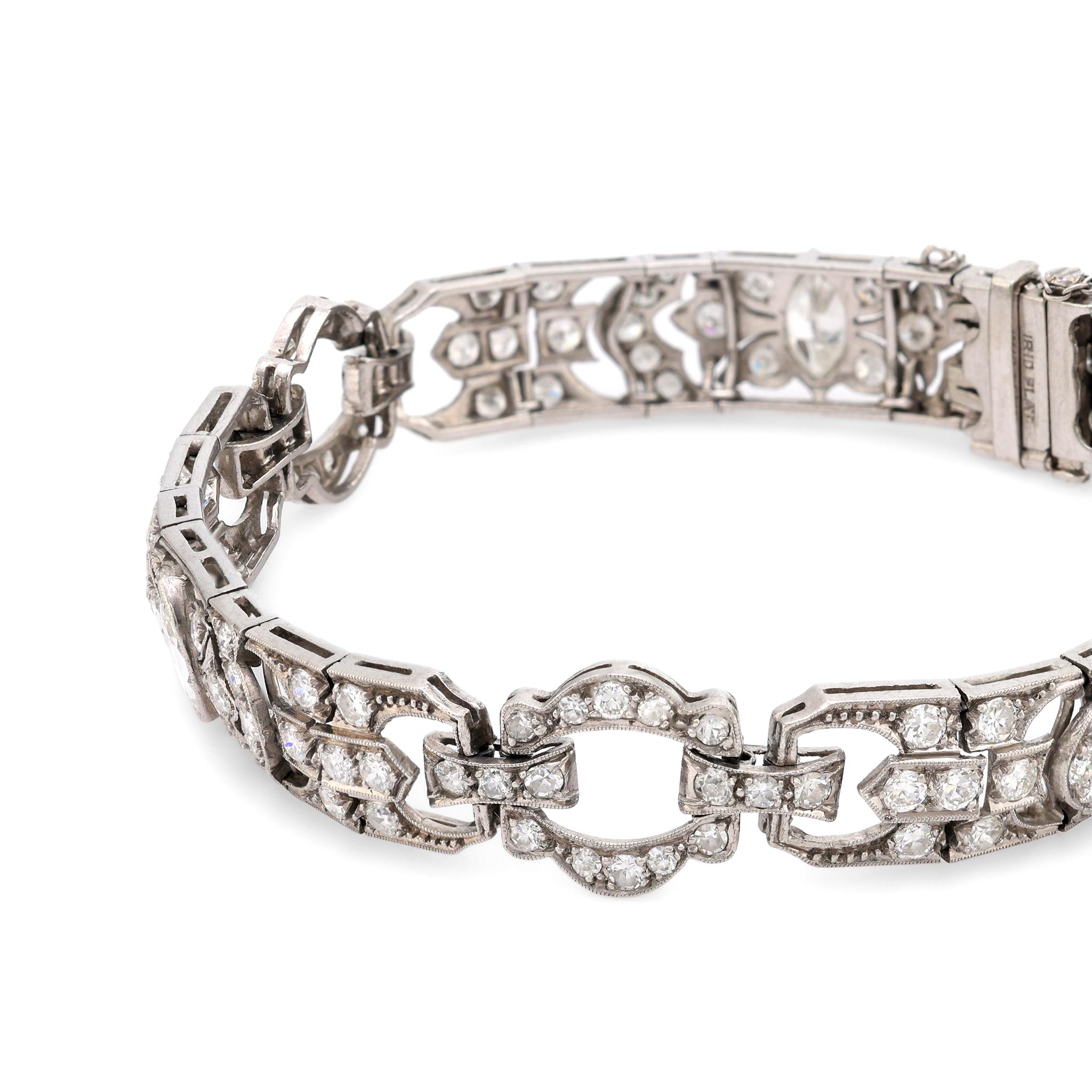 This Art Deco platinum bracelet showcases 7.80 carats of dazzling diamonds, featuring marquise and old European cuts in a timelessly elegant design.

Total diamond weight: Approximately 7.80 carats
Center stone: 3 marquise cut diamonds
Weight: