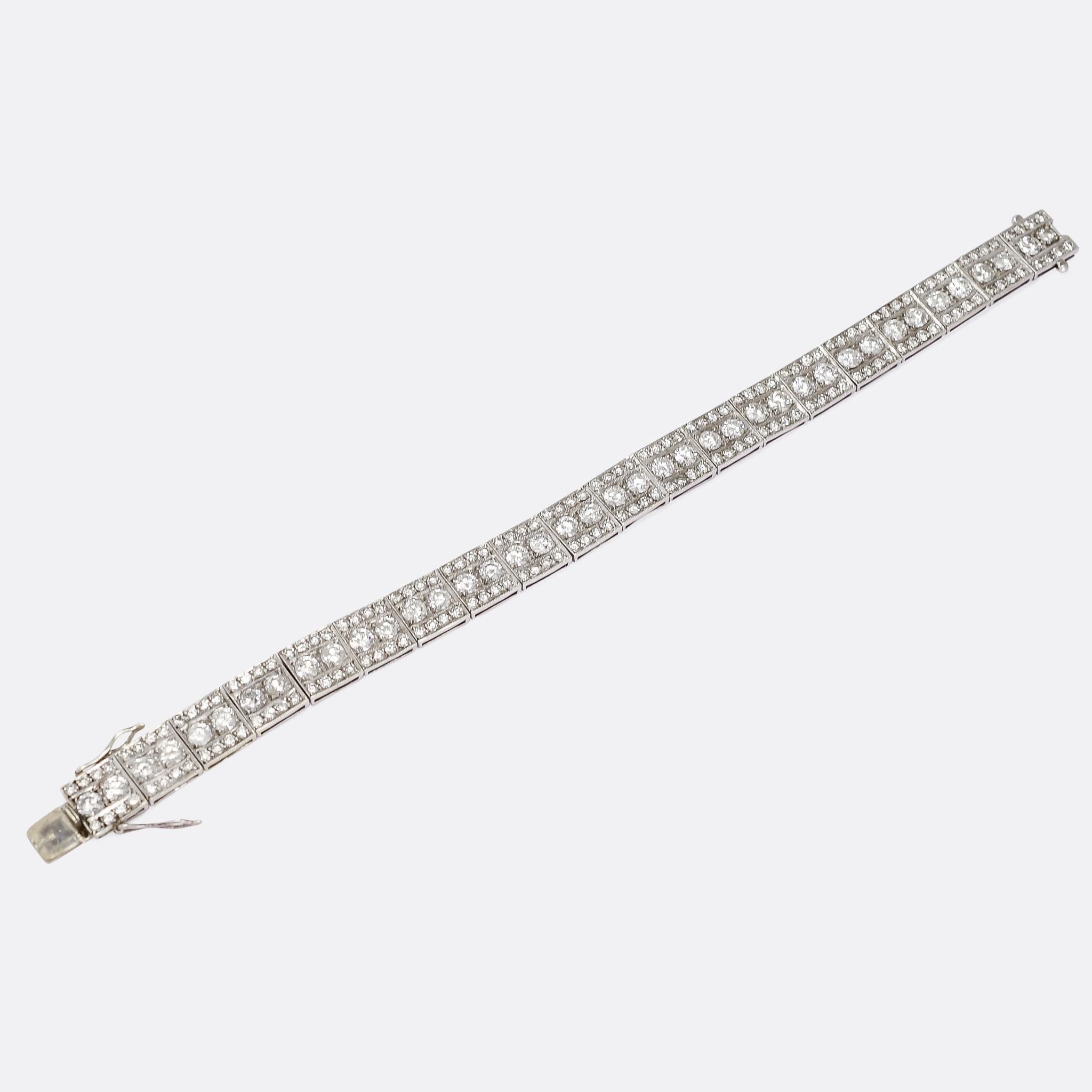A stunning Art Deco diamond millegrain bracelet dating from the 1920s. It's made up of twenty articulated square panels, each one home to .40cts of brilliant cut diamonds in finely worked millegrain platinum settings - with a total diamond weight of