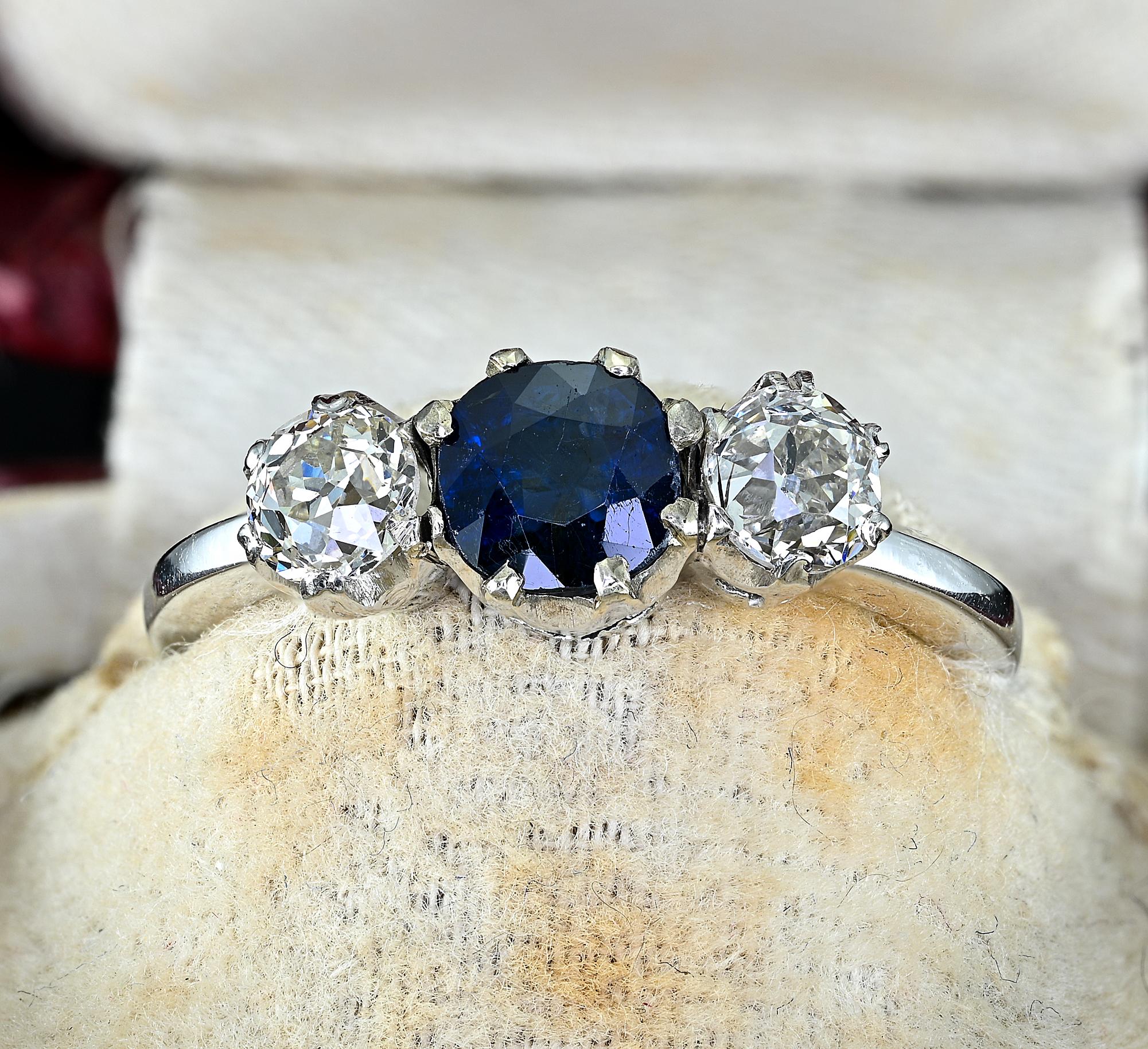 Antique Trilogy
Gorgeous, meaningful Trilogy ring from the Art Deco period 1925 ca
Hand crafted mounting made to exalt each one of the gemstone set on it – made of solid 18 KT white gold – marked
Centrally set with a cushion cut natural intense blue