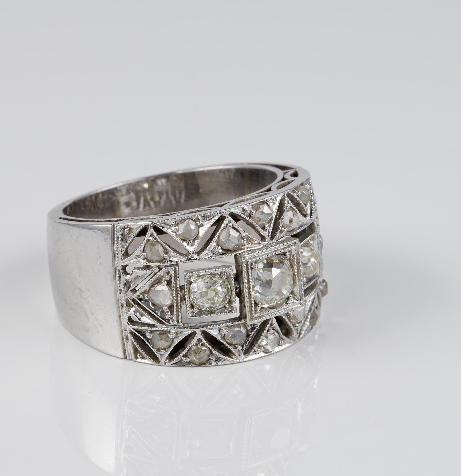This pretty antique wide band ring is Art Deco period, 1920 ca
Exquisitely hand crafted as unique of solid 18 Kt white gold
Skillfully crafted in an amazing pierced work frontal panel with cut a jour geometric pattern work enhanced by Diamonds and