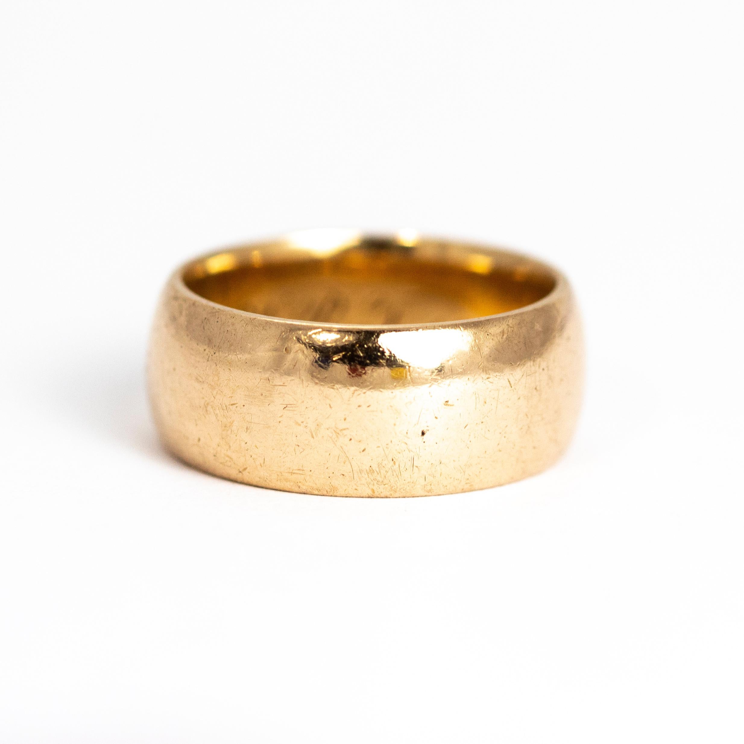 This gold band is modelled out of 9ct gold and is extra wide in width. There is an inscription on the inside of the band which reads 