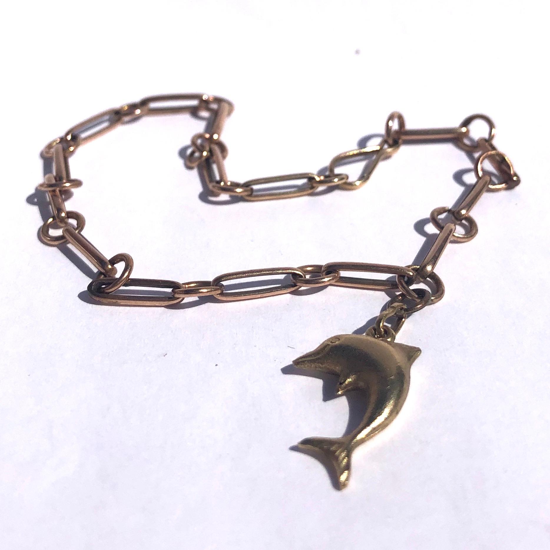 This simple and delicate 9ct gold cain holds a sweet gold dolphin charm. Even the clasp is delicate and just looks like part of the bracelet. 

Length: 20.5cm 
Dolphin Dimensions: 20x13mm 

Weight: 5.1g