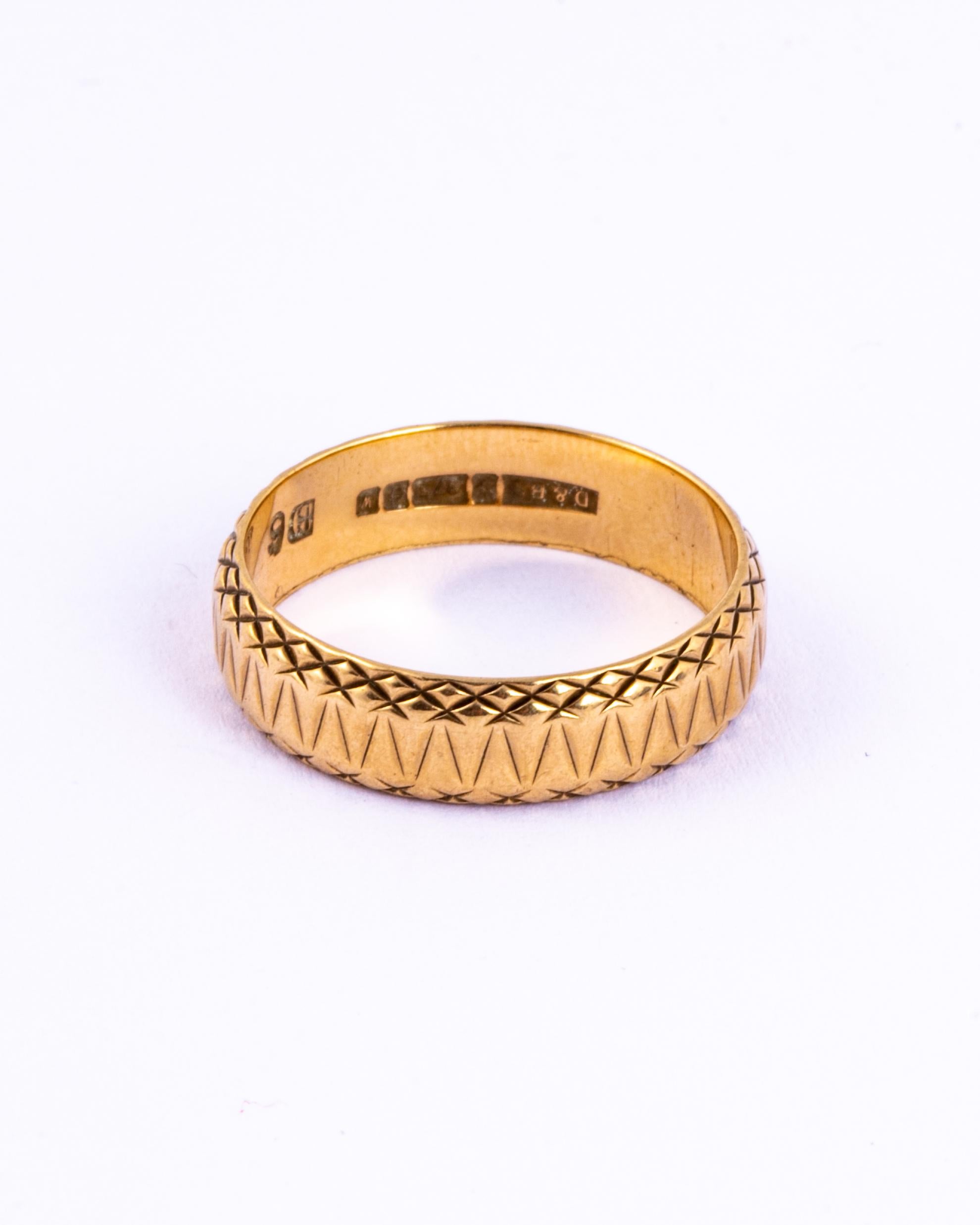 The design engraved beautifully into this 9ct gold band is full of detail. This would make a great fancy wedding band or an ornate everyday ring. Made in Birmingham, England.

Size: Q 1/2 or 8 1/4 
Band Width: 5.5mm

Weight: 3.9g
