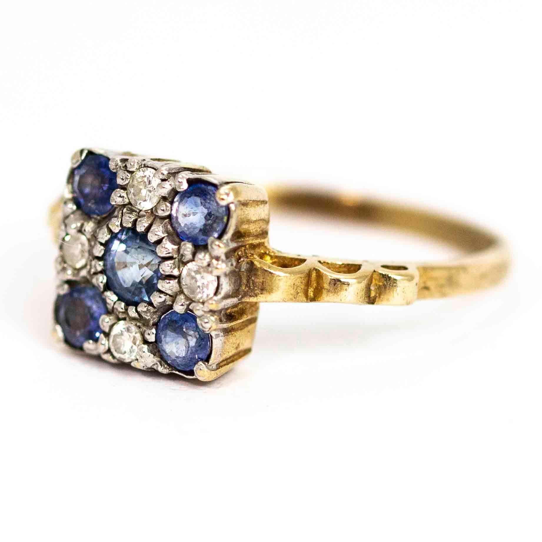 A superb vintage Art Deco ring with a square cluster of sapphire and diamonds. The beautiful central blue sapphire measures 20 points, the four corner sapphires each measure 10 points. The sapphires are spaced by fine 4 points diamonds. The cluster