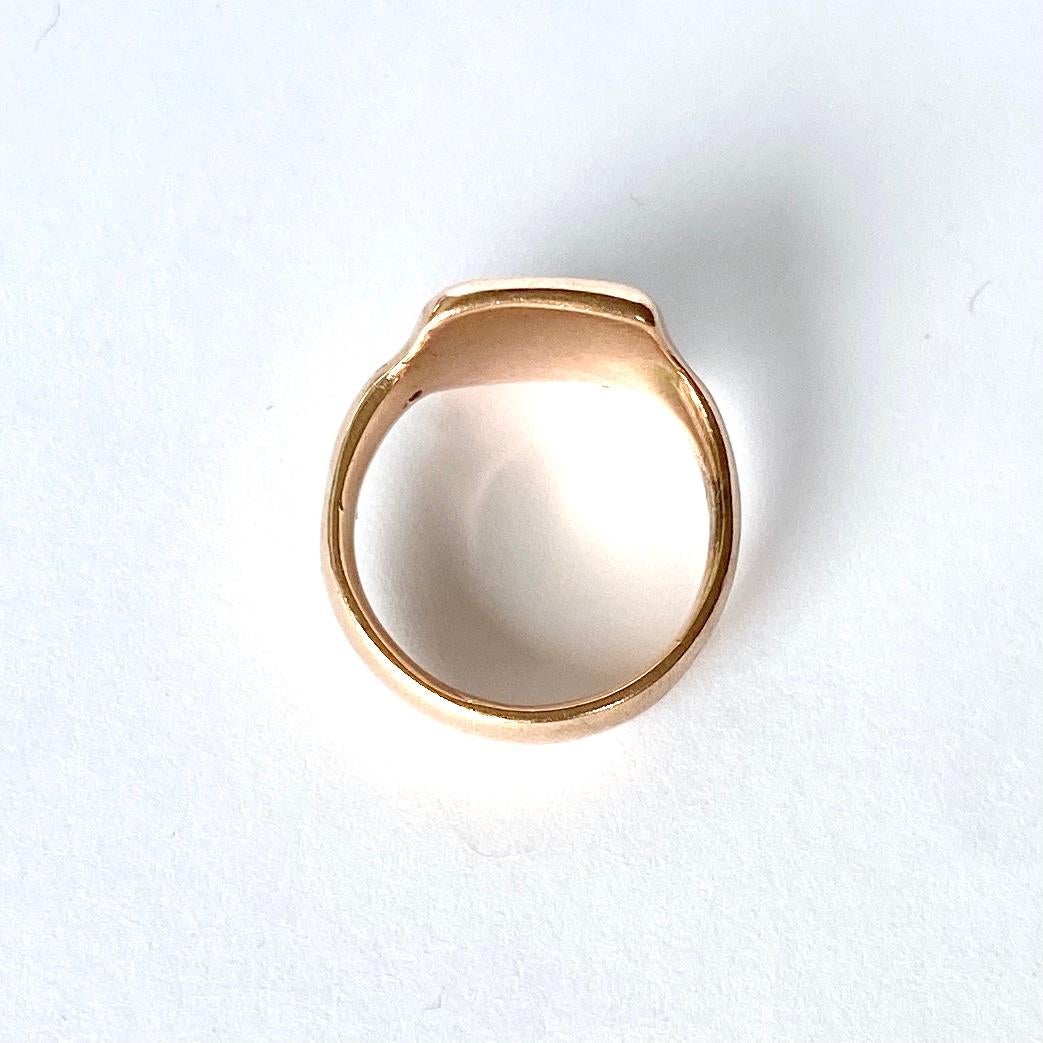 This sweet signet is modelled in 9ct gold and has a face with the initials 'GH' engraved into it.  Fully hallamarked Chester 1917.

Ring Size: M 1/2 or 6 1/2  
Face Dimensions: 14x12mm 

Weight: 8.1g