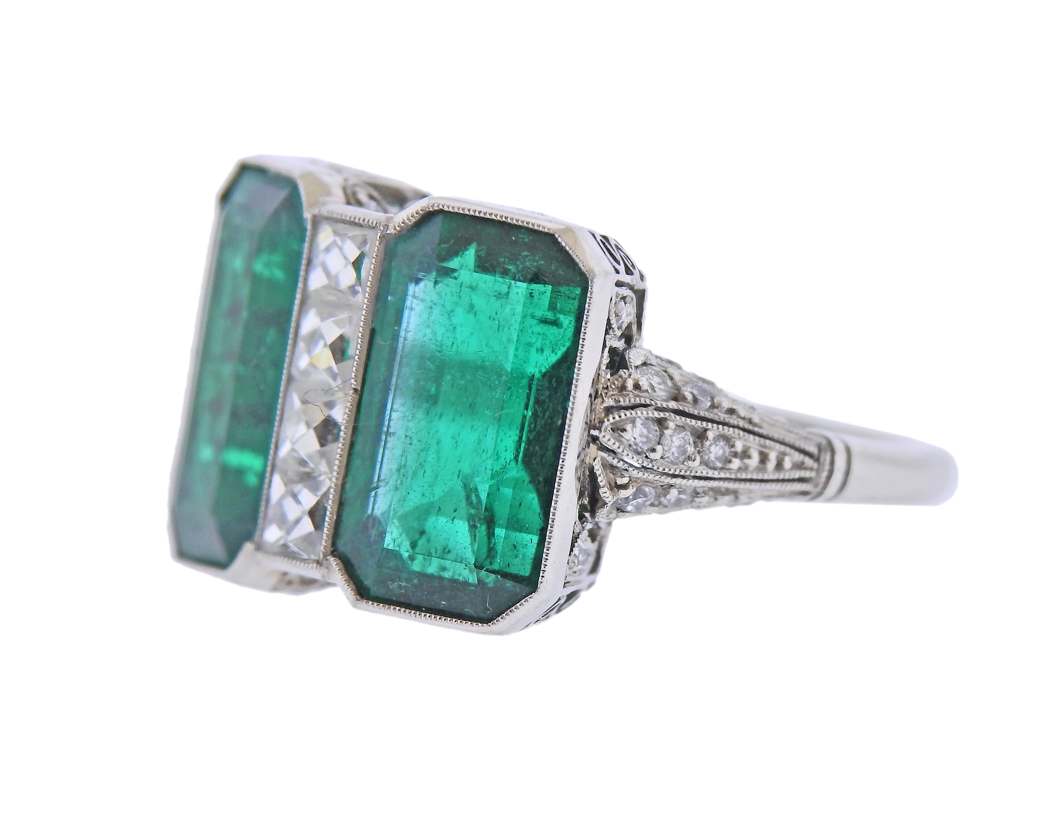 Art Deco platinum ring, featuring two rectangular emeralds, totaling 9.55cts, and approx. 0.73cts in diamonds. Ring size - 6.25, ring top is 14mm x 18mm. Weight of the piece - 8.2 grams.