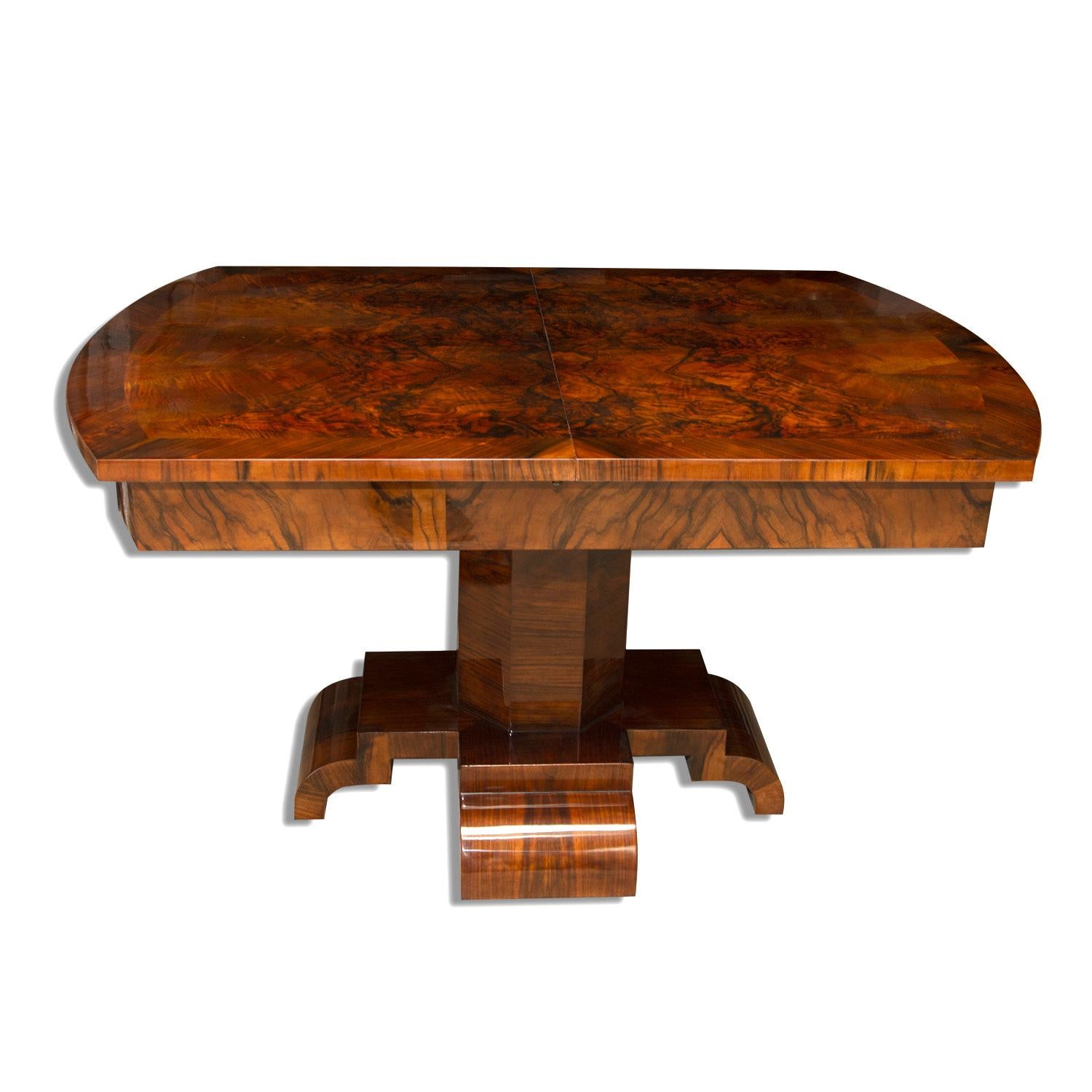 This adjustable Art Deco dining table was made in the 1930s in Central Europe. The table is originally intended for 6-8 people. It features a solid wood with walnut veneer. It was professionally renovated; the wood has been polished to a high gloss