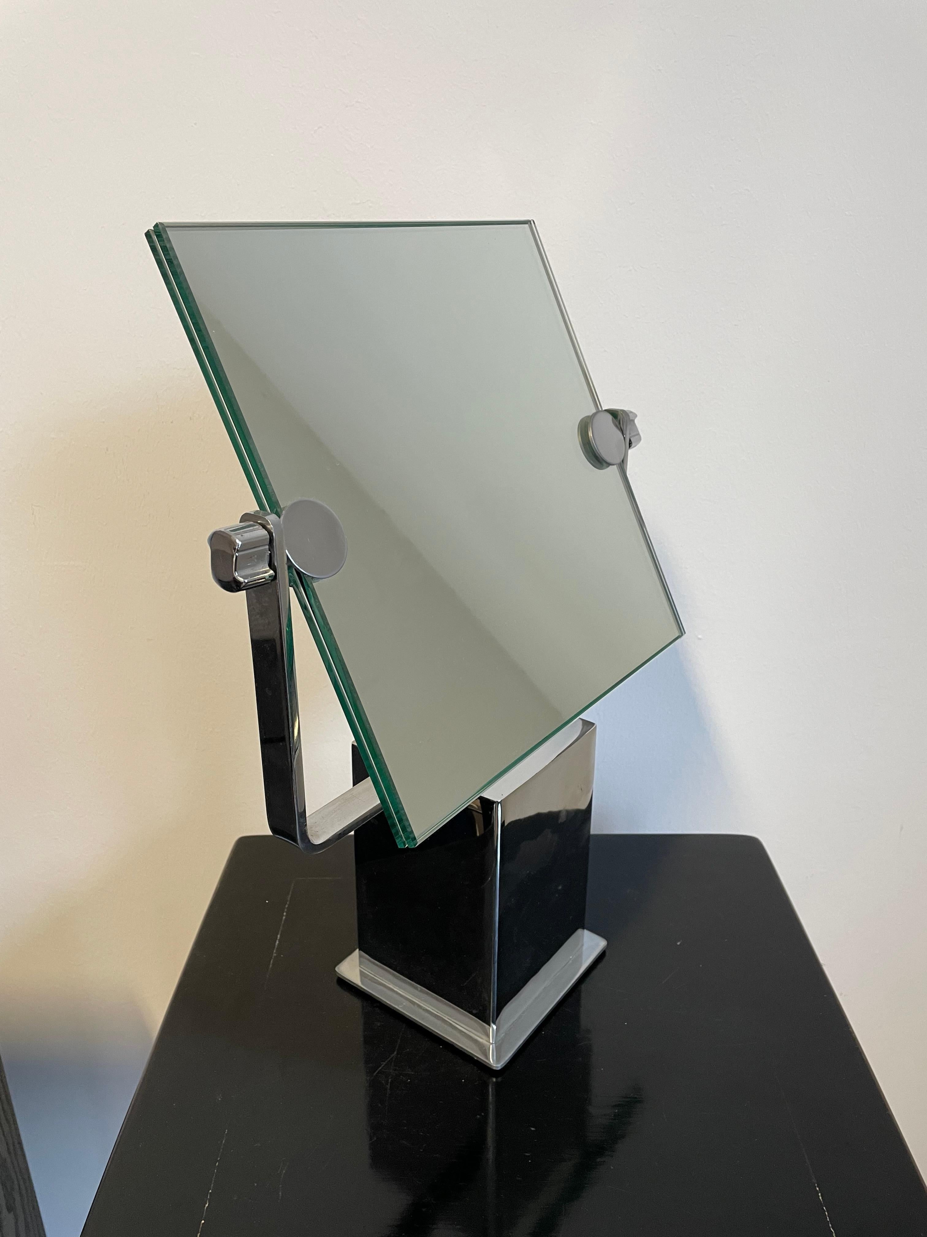 Art Deco Adjustable Table Mirror On Silver Square Chrome Stand 

THE MIRROR IS MODERN AND WILL GO VERY WELL WITH CONTEMPORARY INTERIOR - IT IS NOT A USEFUL ITEM - IT IS A BEAUTIFUL DECORATION FOR EACH VANITY OR DRESSING TABLE

THE MIRROR SHEET IS