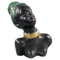 Mid-century African-American female head with turquoise hair by Margit Izsépy