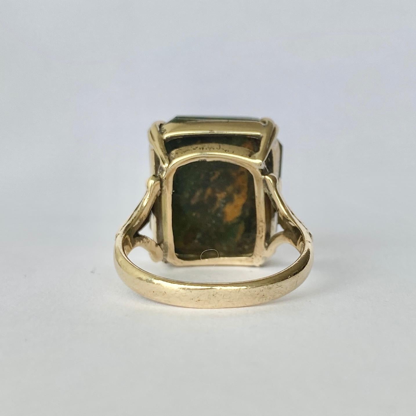 This wonderful agate stone has marbling of deep green and amber colour running through. There are double claws holding the stone and ornate shoulders leading to an open gallery.

Ring Size: P 1/2 or 8
Stone Dimensions: 18.5x16mm 

Weight: 6.3g