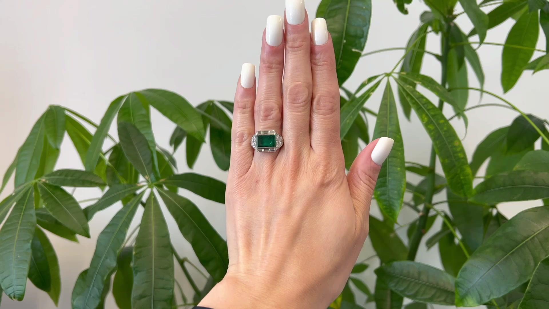 One Art Deco AGL 2.00 Carat Brazilian Minor Oil Diamond Platinum Ring. Featuring one AGL rectangular step cut emerald weighing approximately 2.00 carats, accompanied with AGL #1130631 stating the emerald is of Brazilian origin, and has minor oil.
