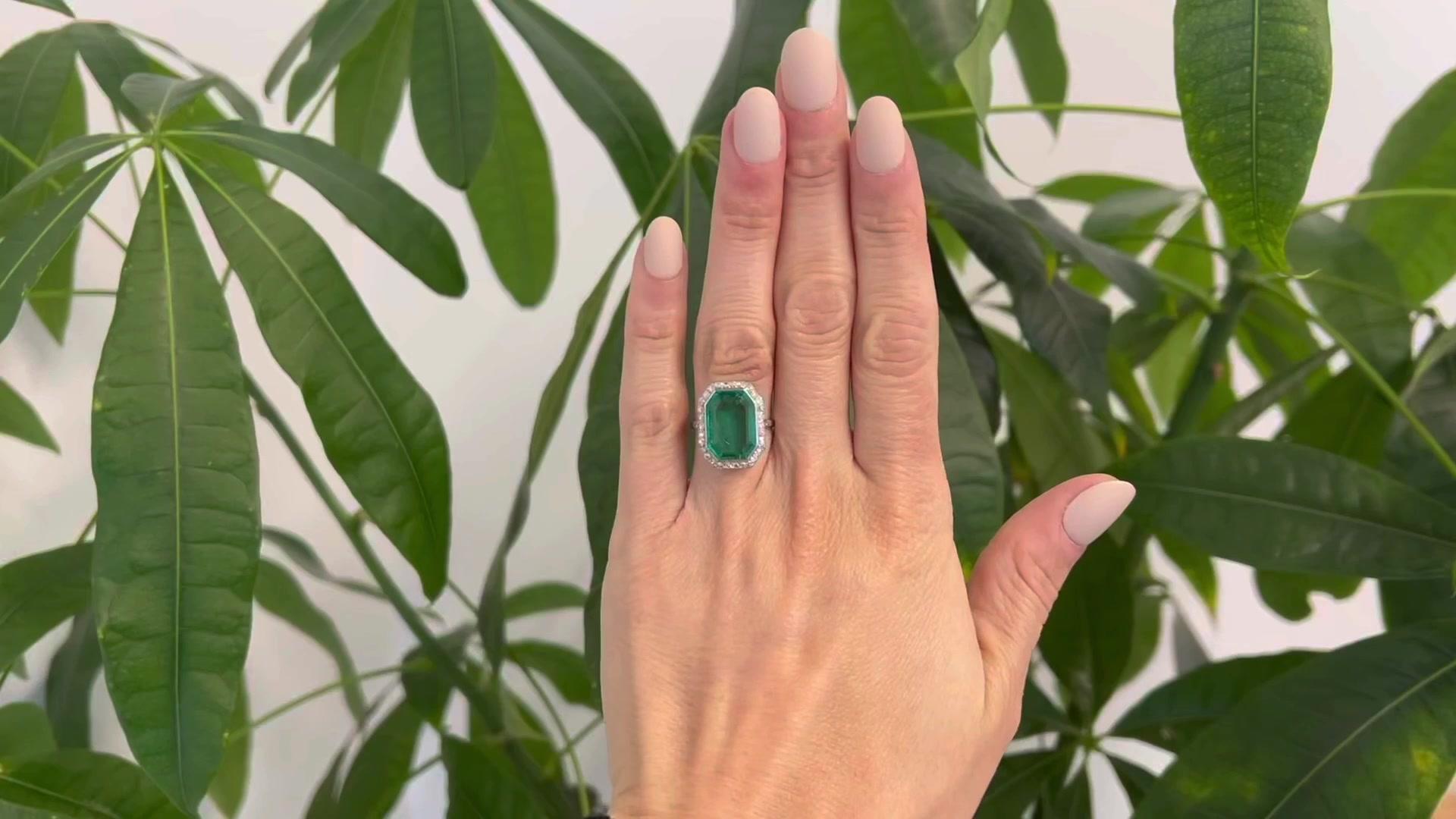 One Art Deco AGL 5.00 Carat  Colombian Emerald Diamond Platinum Ring. Featuring one AGL octagonal step cut emerald weighing approximately 5.00 carats, accompanied by AGL #1127317 stating the emerald is of Colombian origin and has minor oil