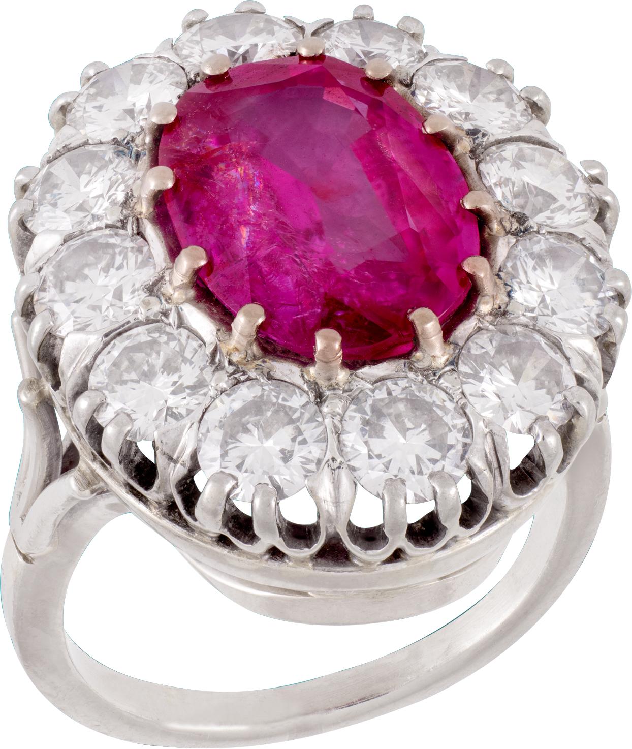 Centering a 5.52 Carat Unheated Burma Ruby (per AGL– American Gem Laboratory), framed by Round-Brilliant Cut Diamonds weighing roughly 3.00 carats, and set in 18k white gold and platinum, this Art Deco ring encapsulates the quality craftsmanship of