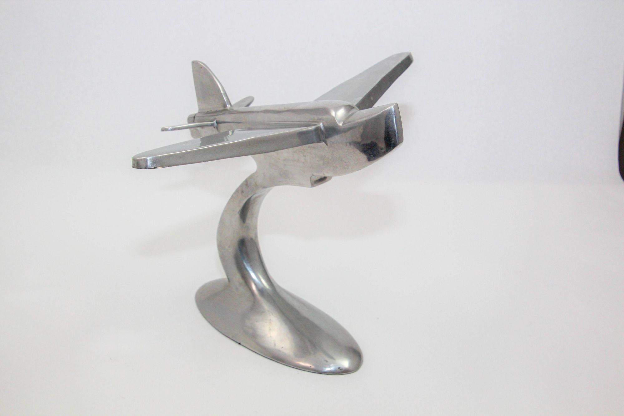 Art Deco Airplane Sculpture of the Boeing 314 Clipper Cast Aluminium.
Aluminum desk model inspired by the Art Deco era of the 1930s and 1940s, showcasing the iconic Boeing 312 Pan Am Flying Clipper Boat design.
This metal airplane reminds us of