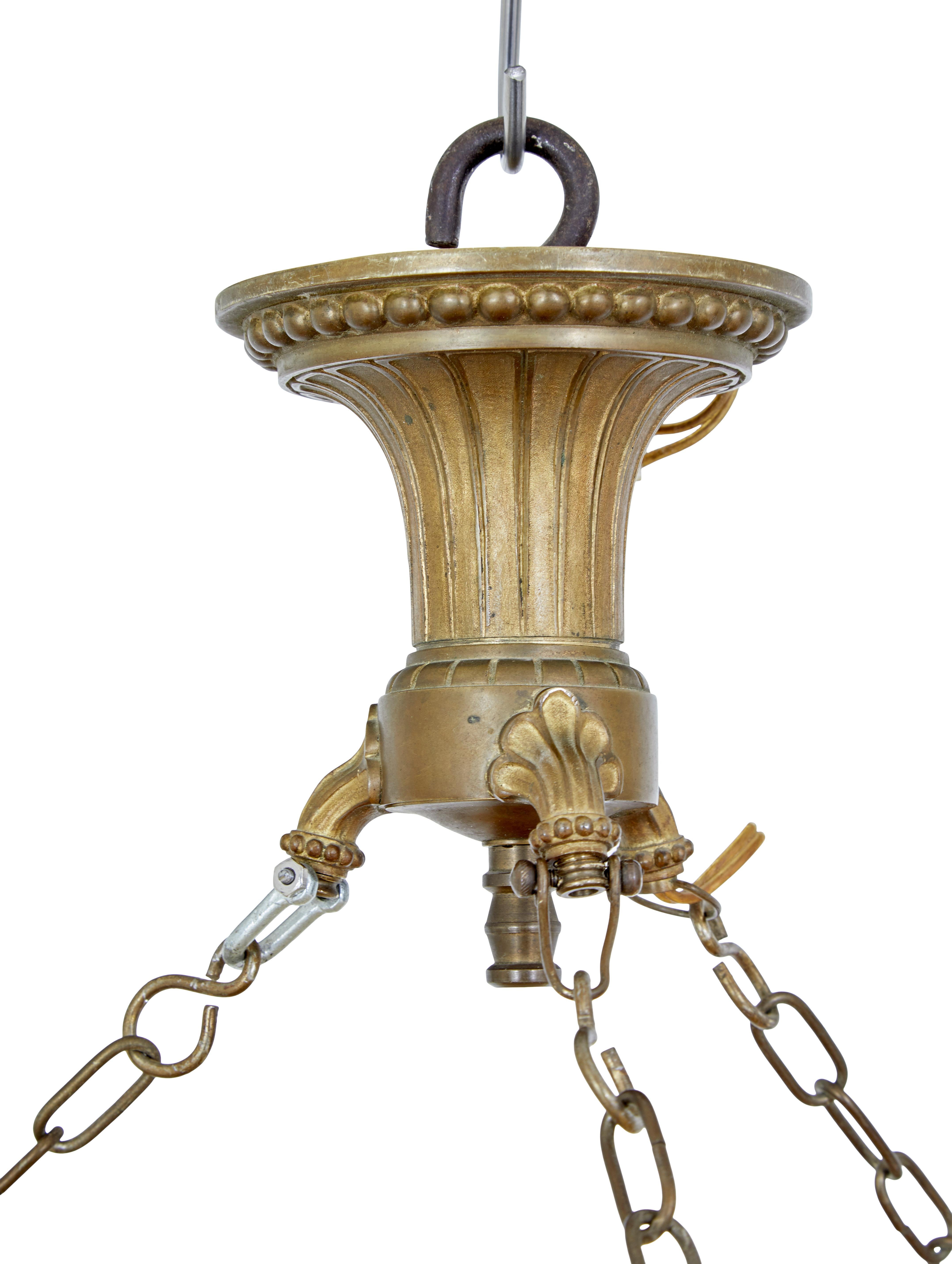 Art Deco alabaster and ormolu pendant light circa 1930.

Stunning alabaster dish light of generous proportions. Natural alabaster dish with 3 applied cast mounts, linked by chain to the ornate cast ormolu ceiling rose.

Light is fitted with 3