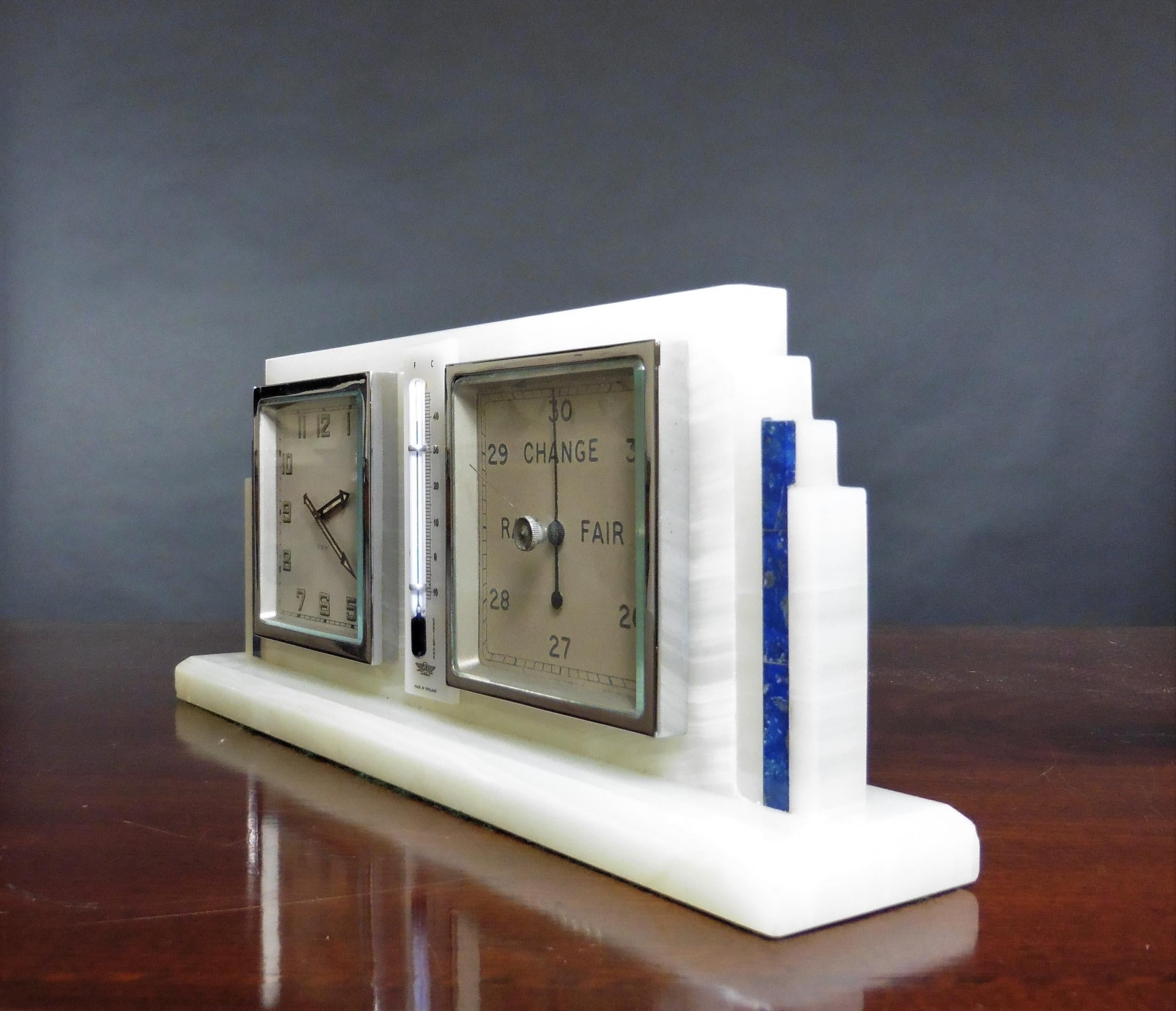 Art Deco alabaster compendium set.


Art Deco alabaster compendium standing on a raised, bevelled plinth with stepped Lapis Lazuli sides.

Eight day clock on the left with painted dial, Arabic numerals and original fluorescent hands.
  