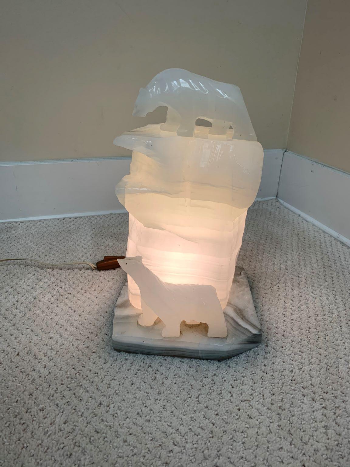 Beautiful Art Deco alabaster lamp with two polar bears on a gray marble base circa 1920’s-1930’s. Add beauty and style to any room or collection. Lamp is in good working order and has not been re-wired. Dimensions 13.5 inches high 7.5 inches wide 8