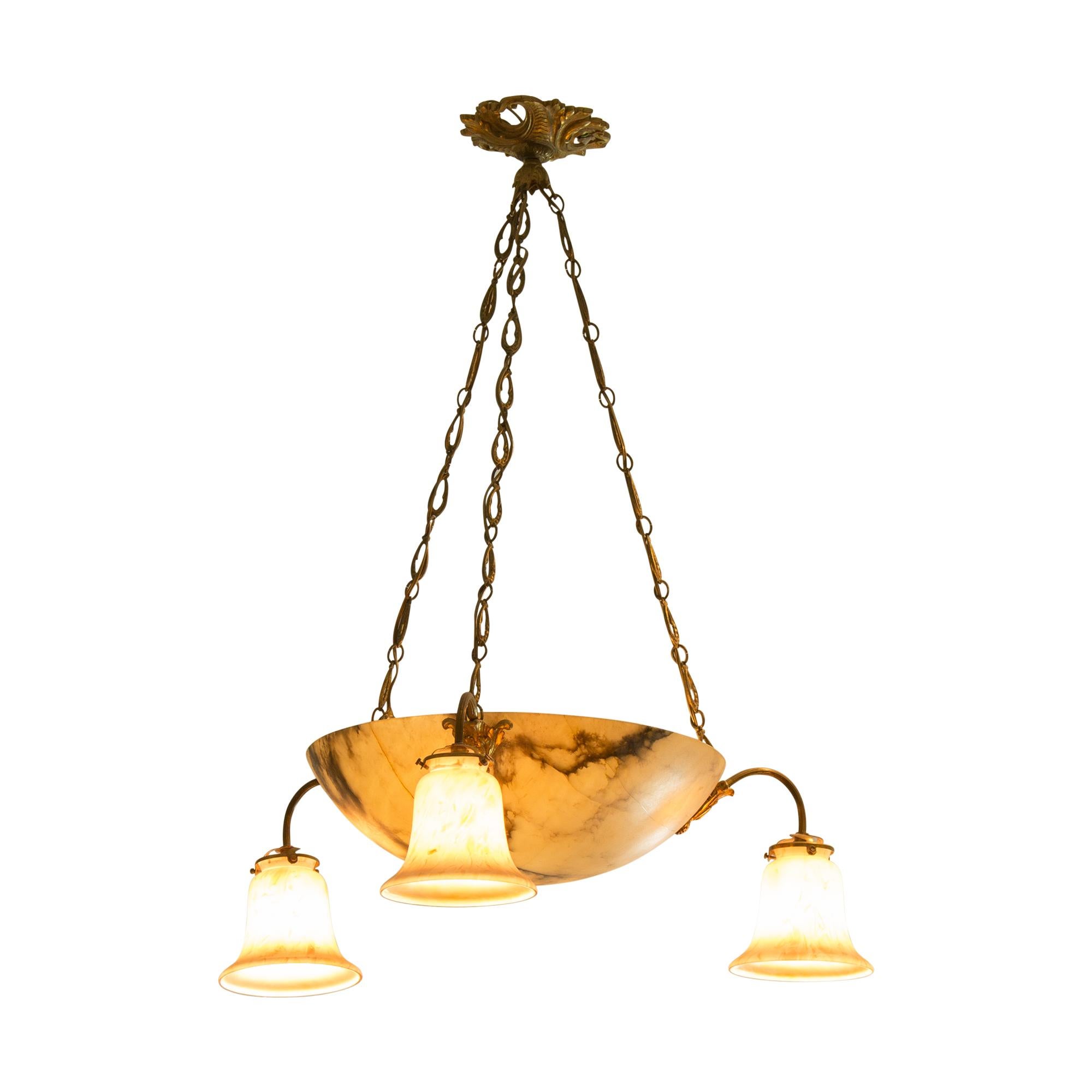 French bronze chandelier from the Art Deco period with alabaster shell shade, suspended from three bronze arms with knotted rope shape. Three curved spots on bronze arms, richly decorated with frosted glass flower shades.
