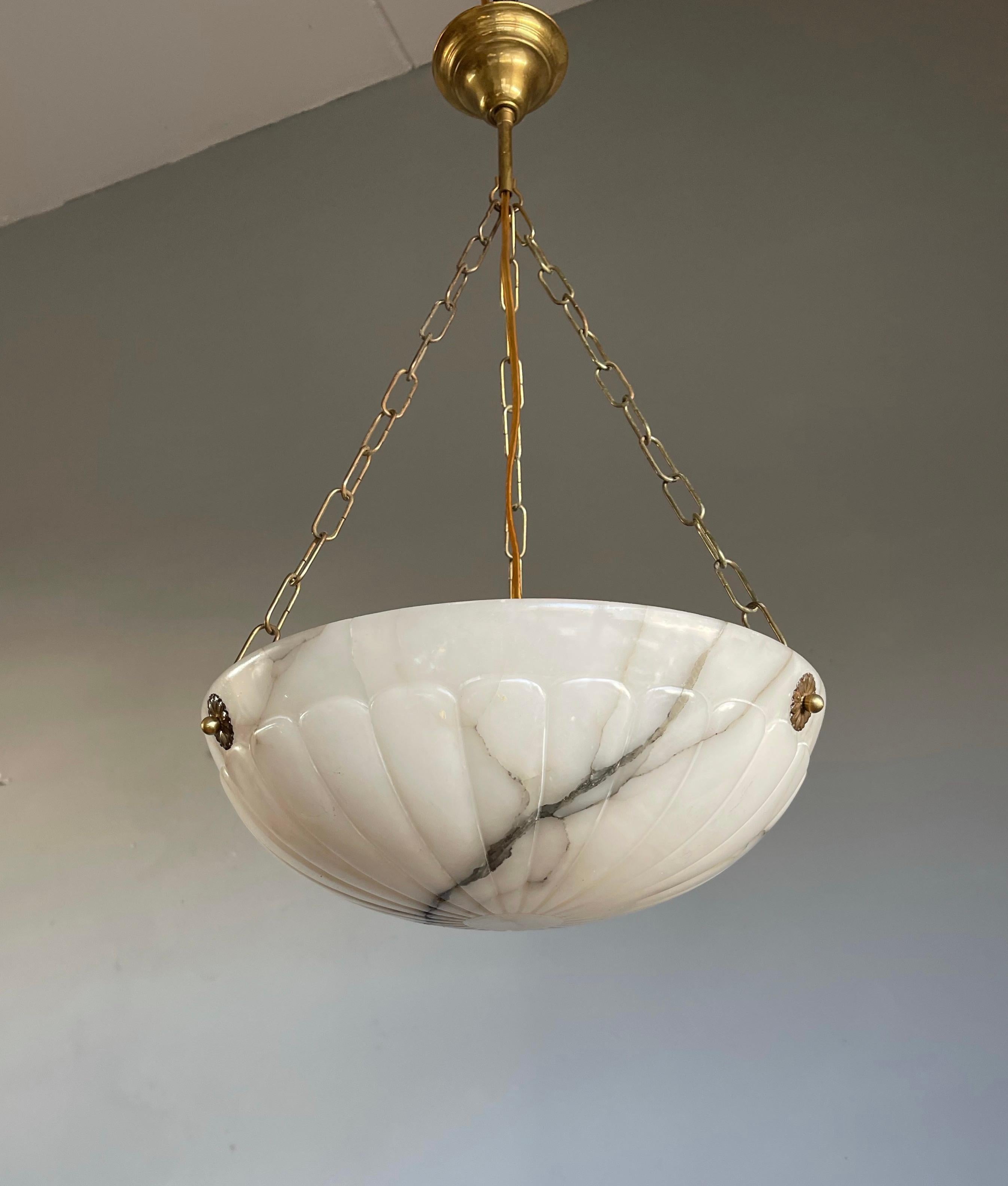 Great shape and practical sizeable alabaster pendant with bronzed canopy & chain.

With early 20th century lighting as one of our specialties, we were again pleasantly surprised to find another unique and truly beautiful small Art Deco pendant. The