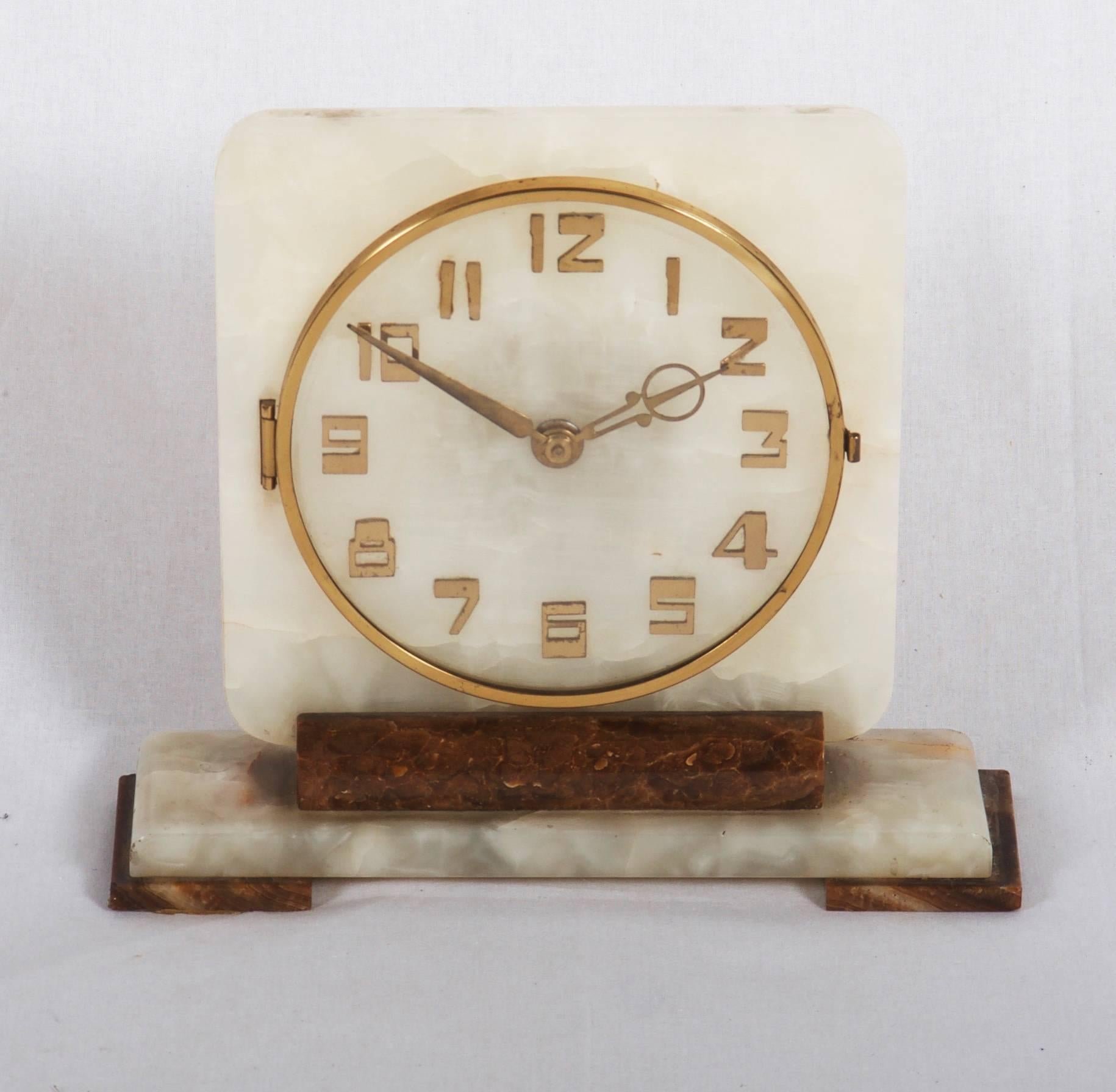 Alabaster with brass movement, digits and pointer, made in Germany in the 1930.