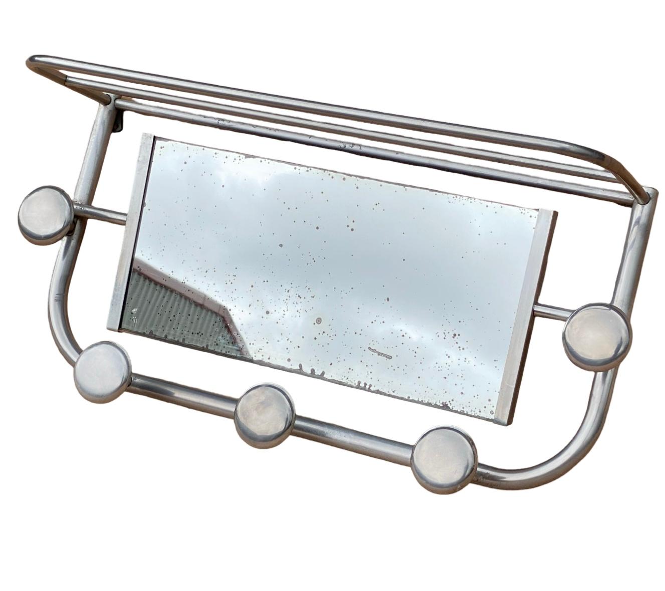 Highly desireable Art Deco Chrome Hooks dating to 1930. These are a wonderful addition to any bathroom or hallway, the hooks are substantial and deep enough to hang several items each on. The mirror is original to the piece and has foxing which is