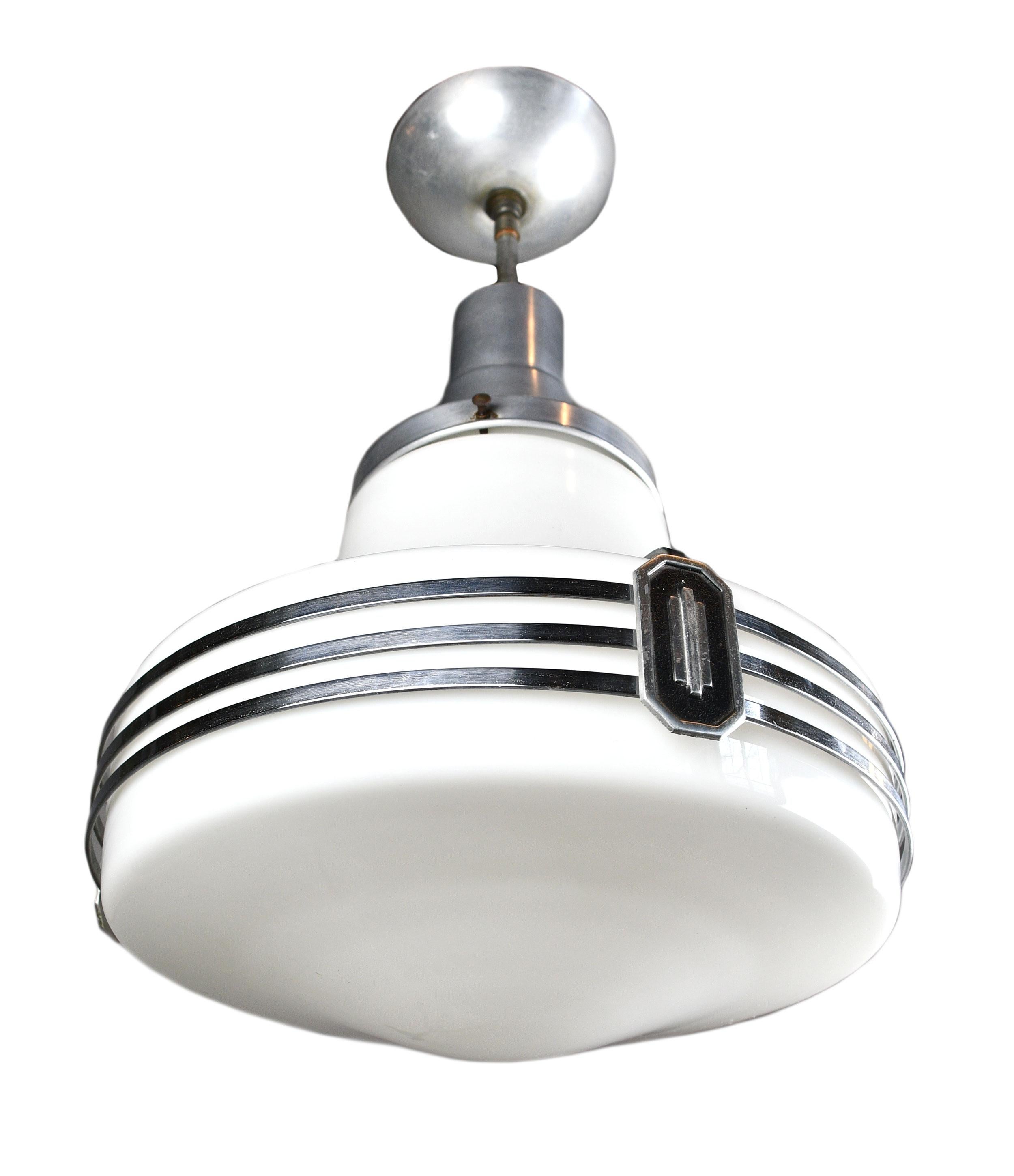These uniquely crafted pendants feature an Art Deco Space Age atomic design and reflective spun aluminum.