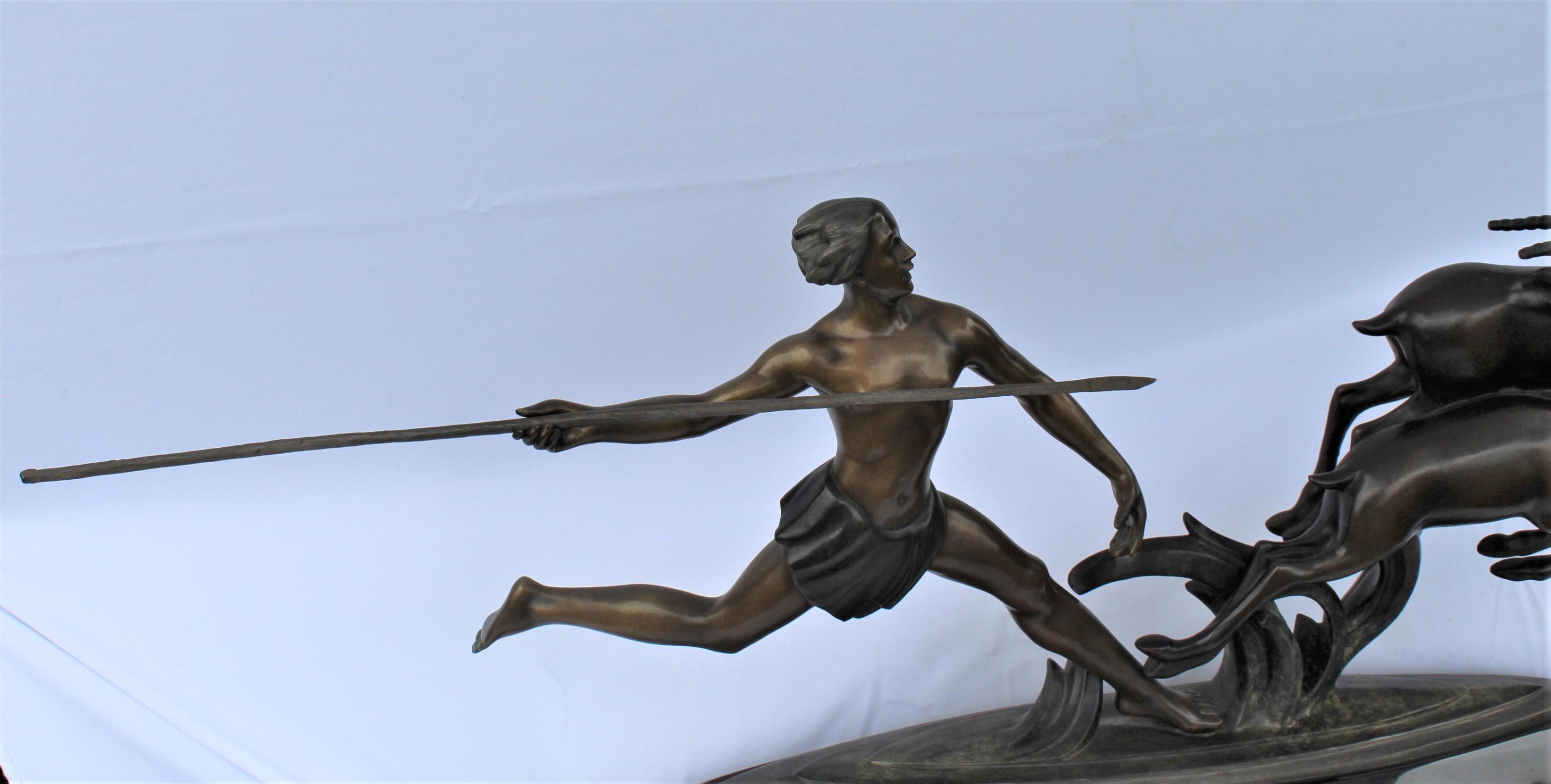 A great super action sculpture of a male hunter after two gazelles. Has a signature on the base of Ketley. A great big piece of absolute marble base. From a private collector of Art Deco Sculpturers. The spear is removable for shipping. Very heavy.