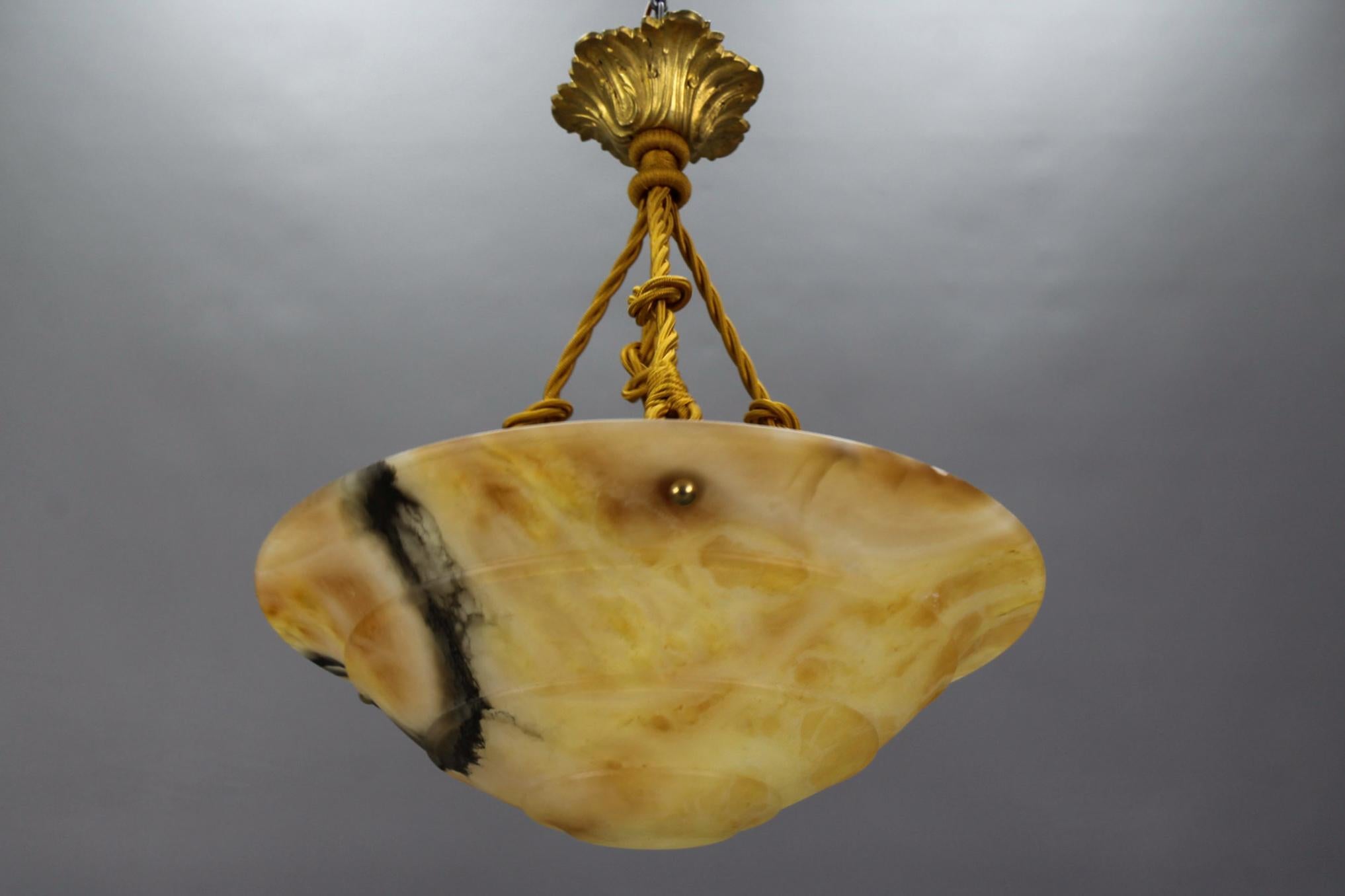 Mid-20th Century Art Deco Amber Color Alabaster and Bronze Pendant Light Fixture, circa 1930 For Sale