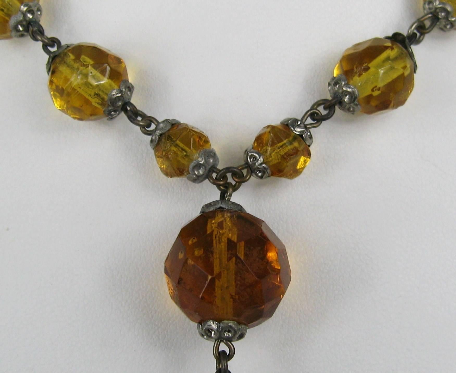 Amber Glass Beads Flapper necklace Ca. 1920s. Beading  measures approx. 7mm - 9.8 mm-12mm-14.50mm. The drop beads measures 28.85mm x 11.80. Length is 29 inches to the drop, then 37 inches. This is out of our massive collection of Hopi, Zuni, Navajo,