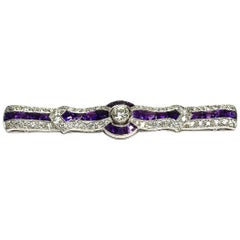 Art Deco Amethyst and 2.3 Carat Diamond Platinum Bow Brooch, circa 1920