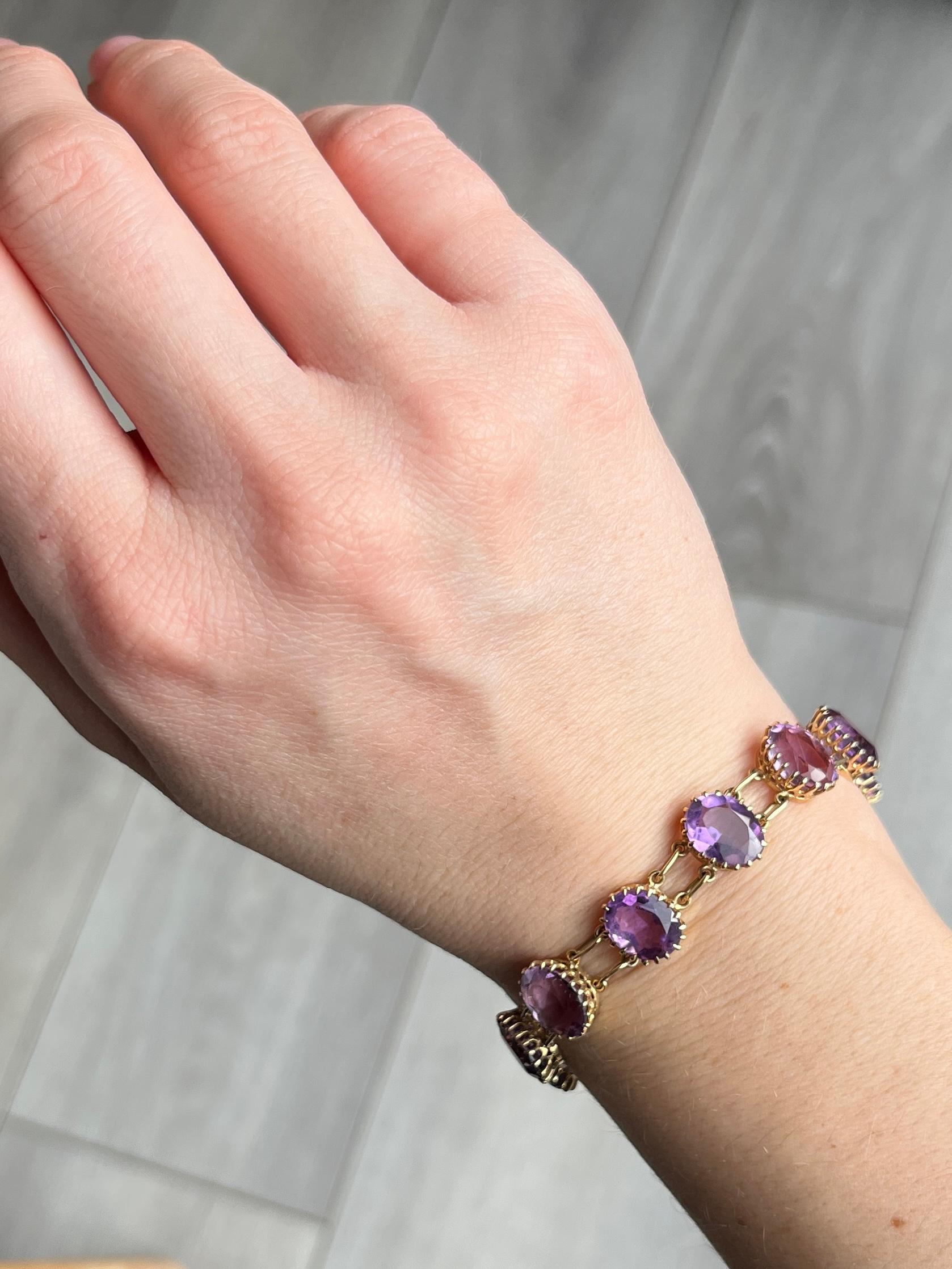 Such a decorative piece! This bracelet is made up of fourteen amethyst stones. The clasp even has an amethyst stone set on it so it is nearly invisible. Modelled in 9 carat gold. 

Length: 20.5cm
Stone Dimensions: 10x8mm

Weight: 17.1g