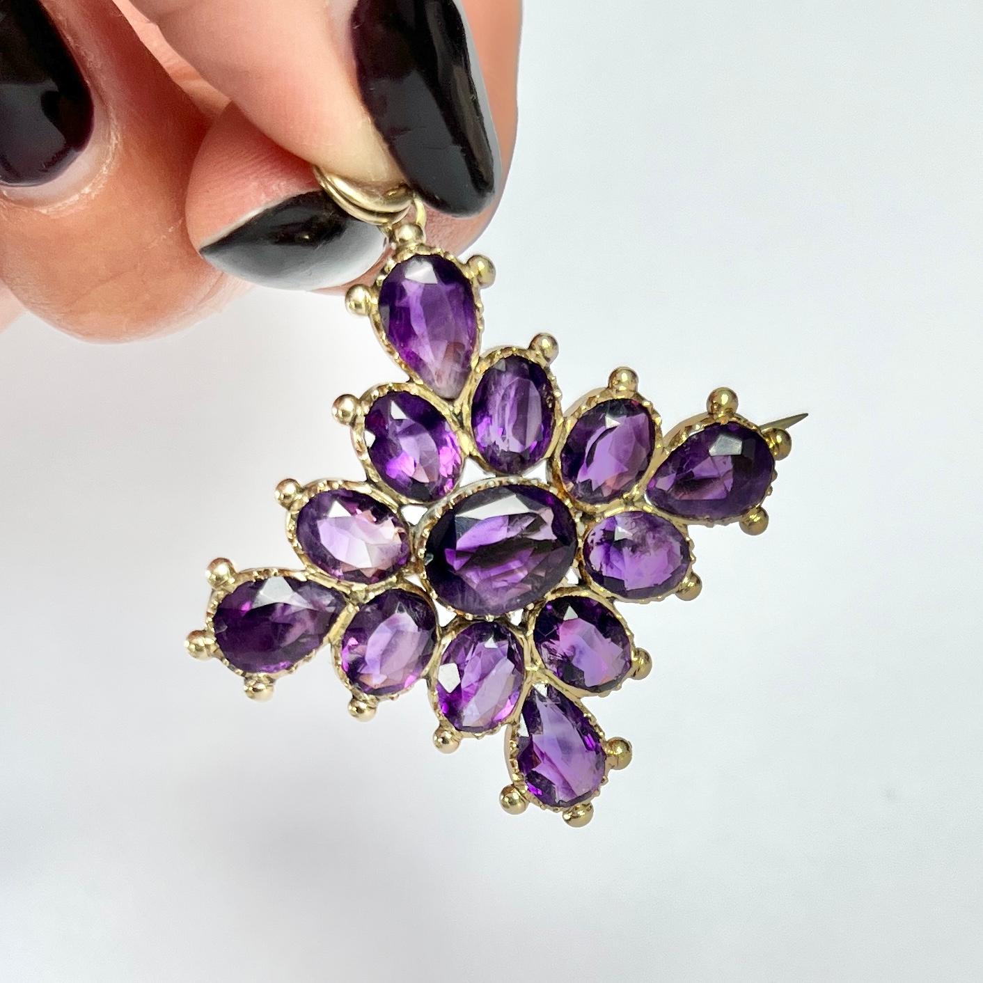This gorgeous pendant or brooch holds 13 bright purple amethyst stones which total approx 8.5ct. The stones are completed by the 9carat yellow gold decorative setting.  

Dimensions: 33x33mm

Weight: 7.4g